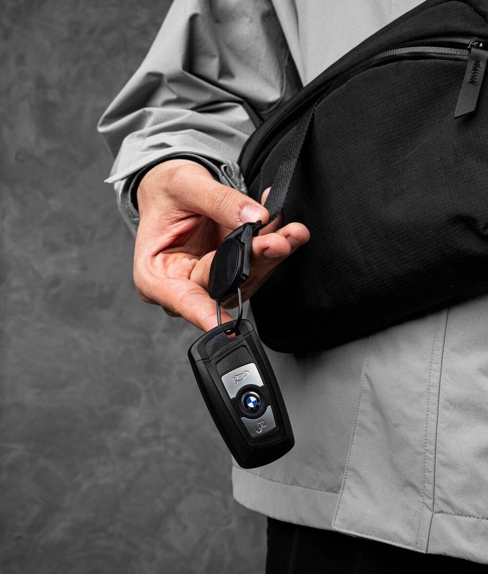 Alt View 1. ALPAKA - ALPAKA Flight Sling 2L Lightweight Packable Travel Sling Bag with Tablet Sleeve and Detachable Strap - Black/Grey Axoflux 400D.