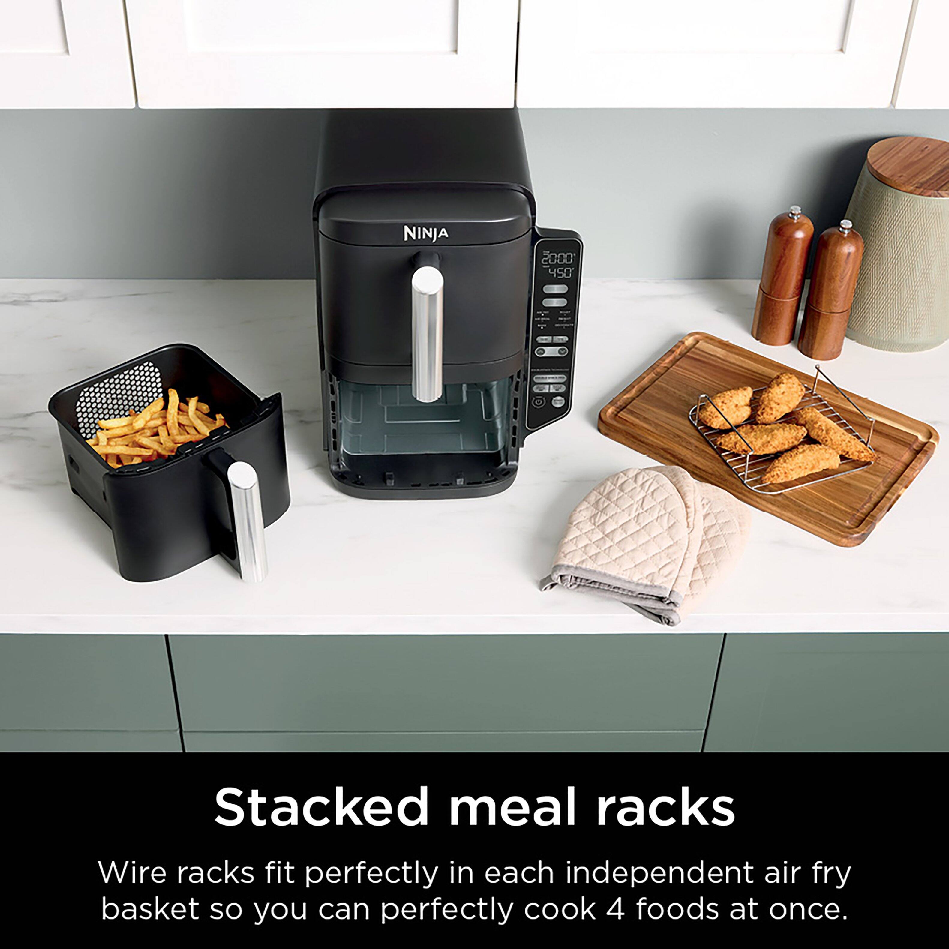 Stacked meal racks are a convenient way to cook multiple foods at once using a Ninja 2000 450 air fryer. The wire racks fit perfectly inside each independent air fry basket, allowing you to cook up to four foods at once. This saves time and energy, making it a practical choice for busy households or those who enjoy preparing a variety of dishes.