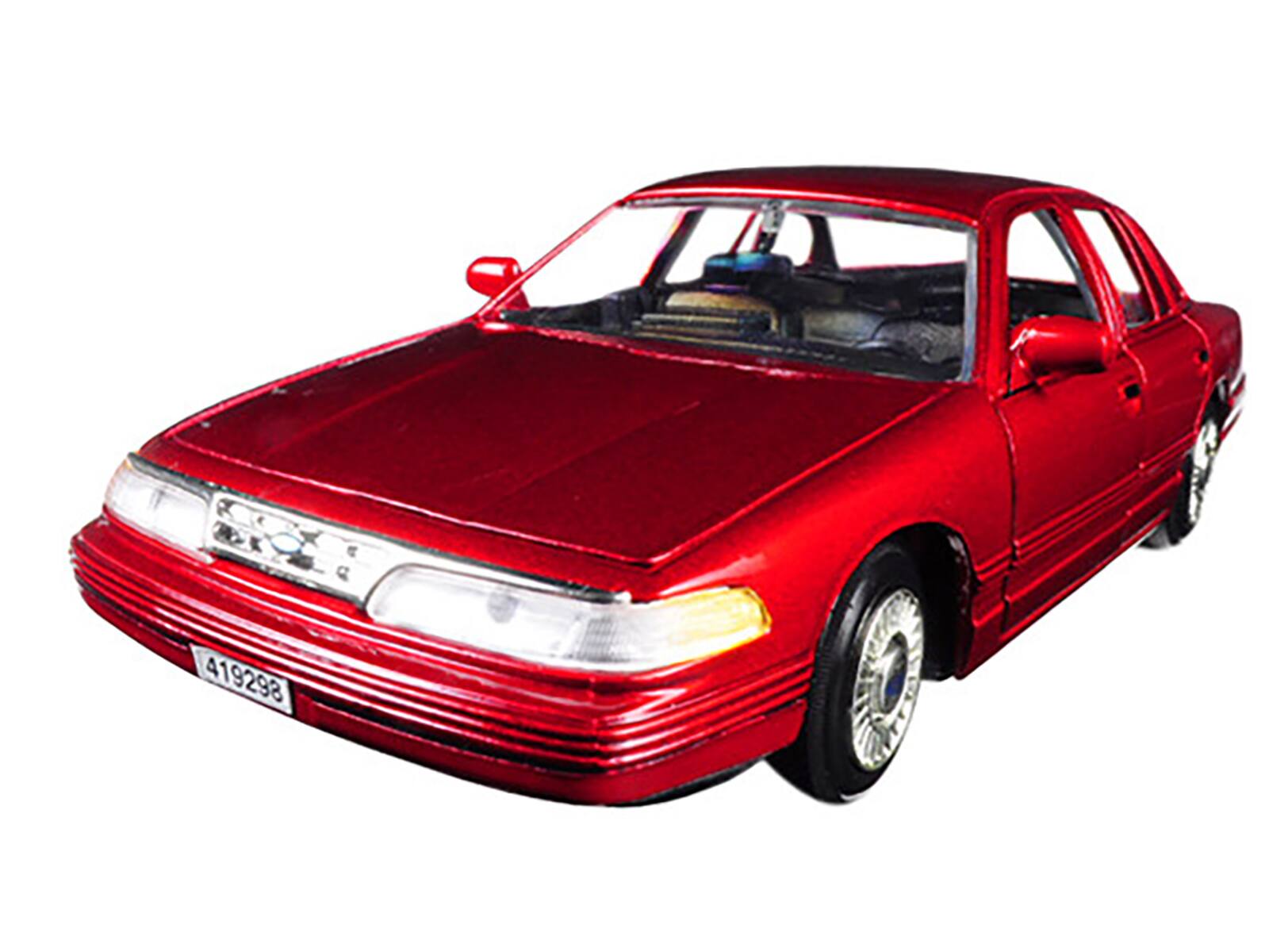 Angle. Motormax - 1998 Ford Crown Victoria Metallic Red 1/24 Diecast Model Car by Motormax - Metallic Red.
