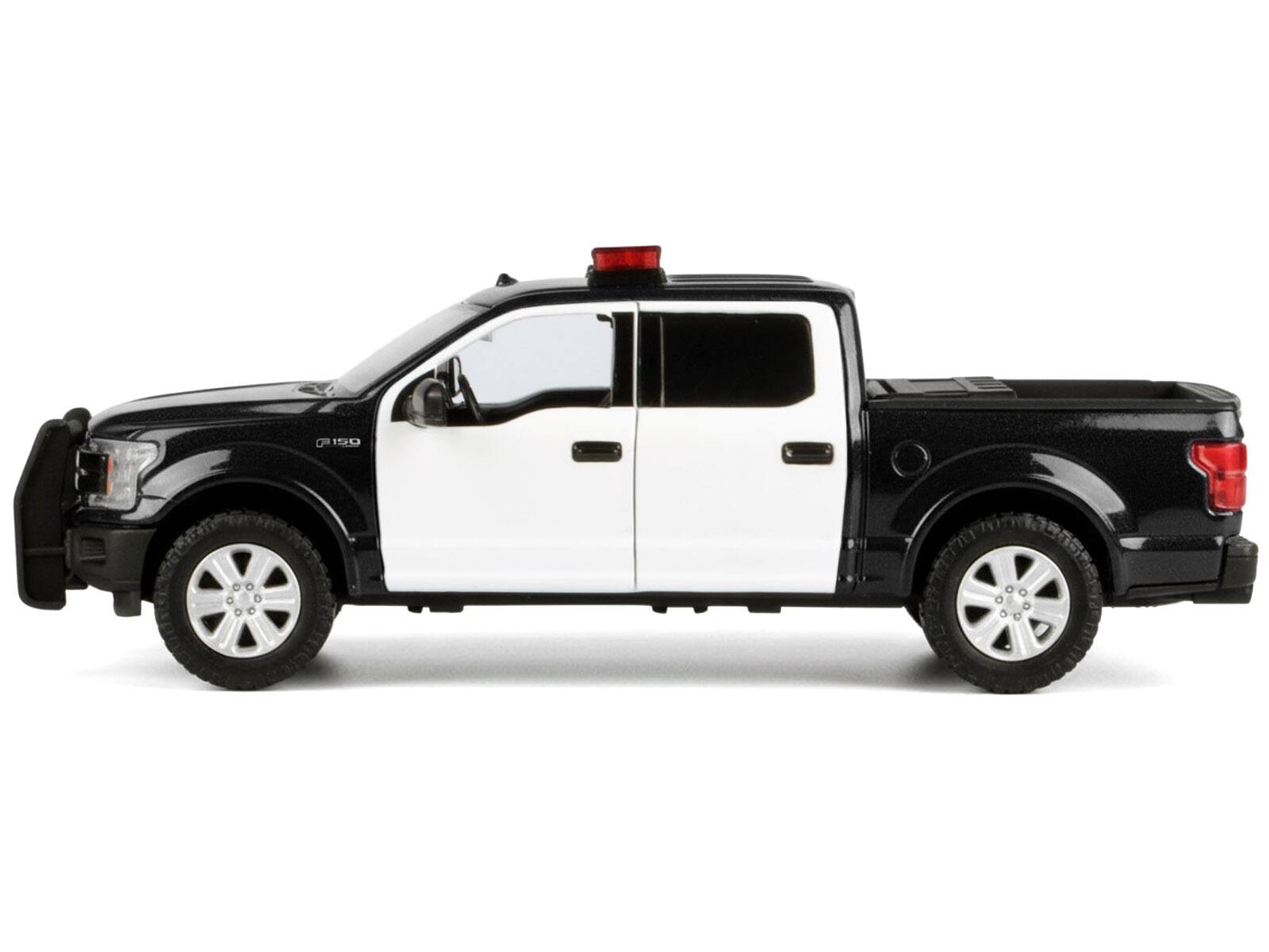 Alt View 2. Motormax - 2019 Ford F-150 Lariat Crew Cab Pickup Truck Black and White with Light Bar and Sounds 1/27 Model Car by Motormax.
