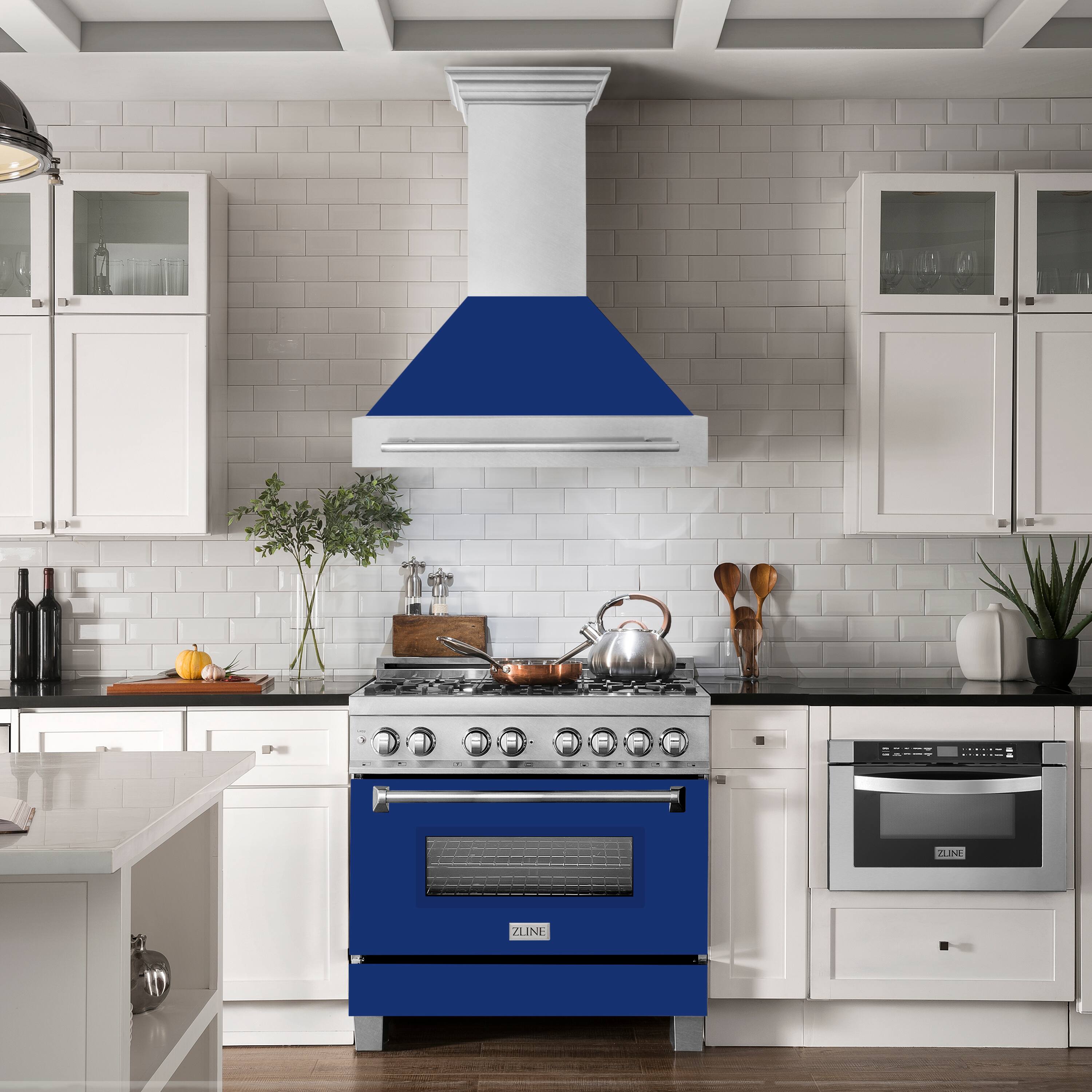 The image features a kitchen with a blue stove top oven, a white stove, and a blue hood. The kitchen is well-equipped with various utensils, including multiple knives, spoons, and a bowl. There are also several bottles and a potted plant in the room. The kitchen has a clean and modern appearance, with white cabinets and a blue accent on the stove and hood.