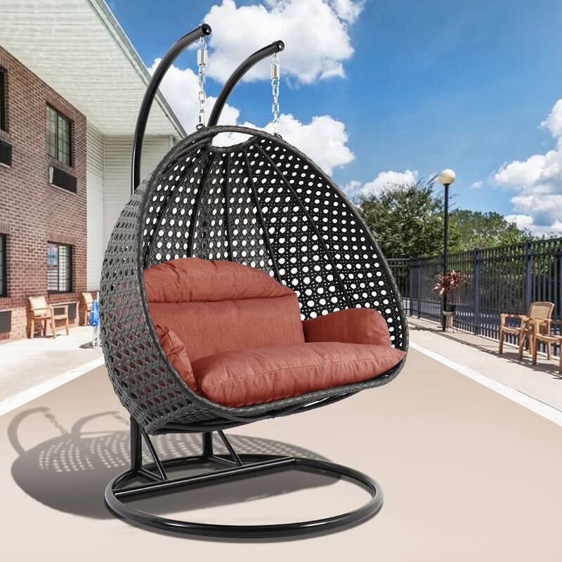 Angle. LeisureMod - Leisuremod Outdoor 2-Person Charcoal Wicker Egg Swing Chair with Steel Stand, Washable Cushions & Waterproof Cover - Dark Orange.