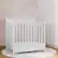 Angle. Storkcraft - Petal Mini 4-in-1 Convertible Crib - White.