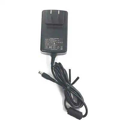 The text on the image reads:
"POWER ADAPTER MUR
MODEL: W00301
INPUT: 100-240V~ 1.5A 50/60Hz
OUTPUT: 12V 2A
EFFICIENCY LEVEL: III
FCC
CE
MADE IN CHINA"