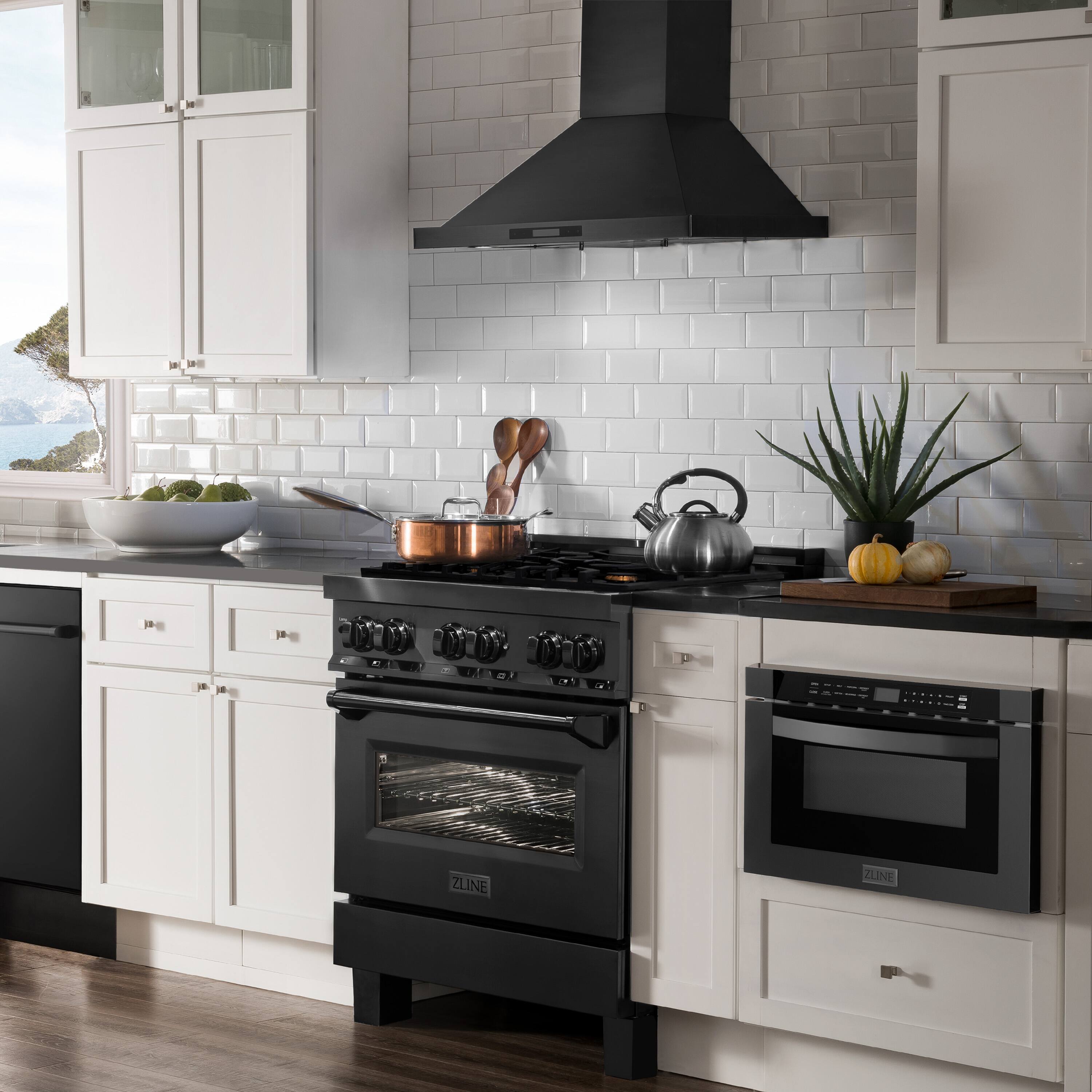 The image features a kitchen with a black stove top oven and a black hood. The kitchen is white and has a window that provides a view of the ocean. There are various items on the countertop, including a bowl, a banana, a spoon, a knife, and a potted plant. The oven is positioned under the hood, and the countertop is cluttered with different items.