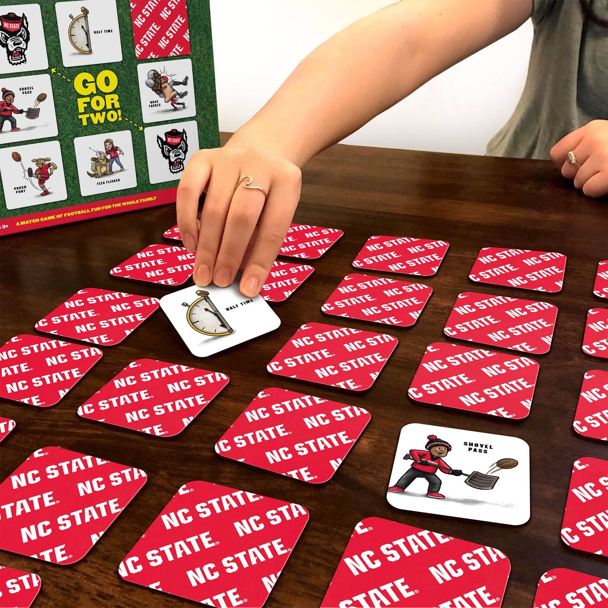 Sure, here is the corrected and grouped text from the image:

**Top Left Card:**
- GO FOR TWO!
- A MATCH GAME OF FOOTBALL FOR THE WHOLE FAMILY

**Top Right Card:**
- HALFTIME
- TRAVEL
- MISSILE
- POOR FOOT
- TIE FUMBLE
- SHOVEL PASS

**Bottom Left Card:**
- HALFTIME

**Bottom Right Card:**
- SHOVEL PASS

**Red Cards:**
- NC STATE
- NC STATE
- NC STATE
- NC STATE
- NC STATE
- NC STATE
- NC STATE
- NC STATE
- NC STATE
- NC STATE
- NC STATE
- NC STATE
- NC STATE
- NC STATE
- NC STATE
- NC STATE
- NC STATE
- NC STATE
- NC STATE
- NC STATE
- NC STATE
- NC STATE
- NC STATE
- NC STATE
- NC STATE
- NC STATE
- NC STATE
- NC STATE
- NC STATE
- NC STATE
- NC STATE
- NC STATE
- NC STATE
- NC STATE
- NC STATE
- NC STATE
- NC STATE
- NC STATE
-