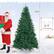 The image features a Santa Claus figure holding a Christmas tree and a pair of gloves. The tree is 7.5 feet tall, and the gloves are 4.3 feet tall.