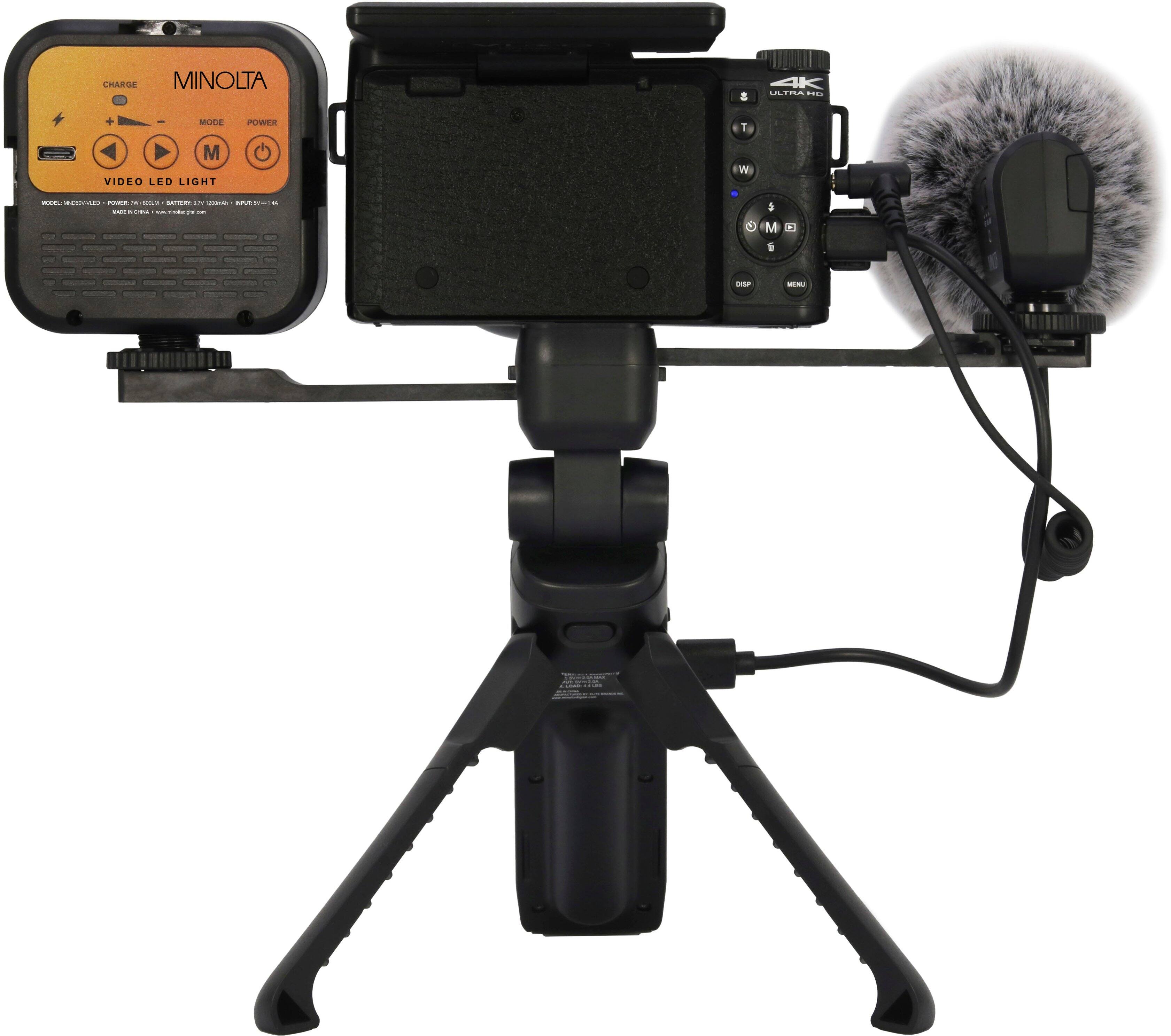 The text on the image reads: "CHARGE MINOLTA adid MUSH PUWER T M VIDEO LED LIGHT W -- - - - SSRY ... - - - .. - . - - . $ M".