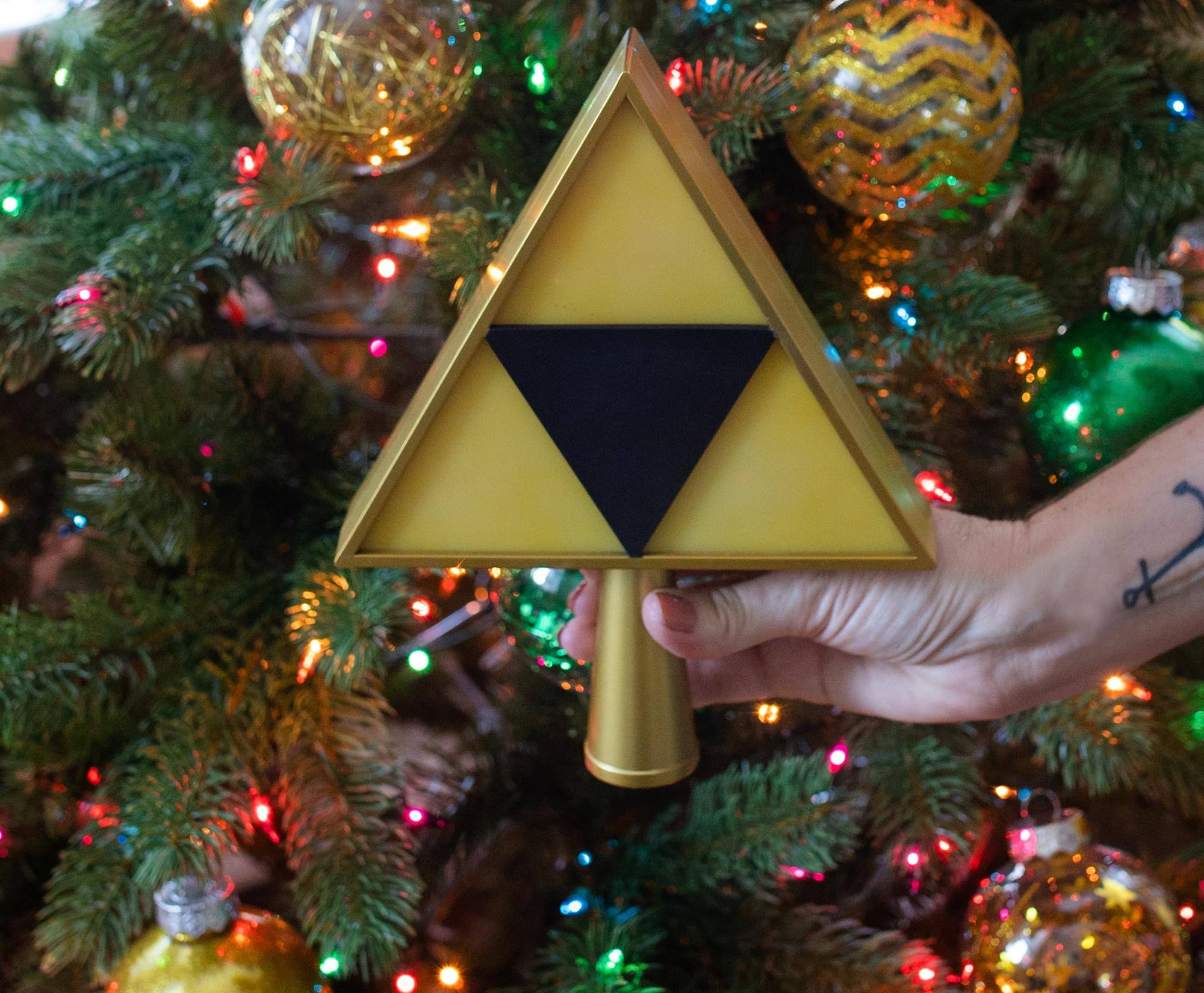 Alt View 2. Halo - The Legend of Zelda 7-Inch Triforce Light-Up Holiday Tree Topper Decoration - Yellow.