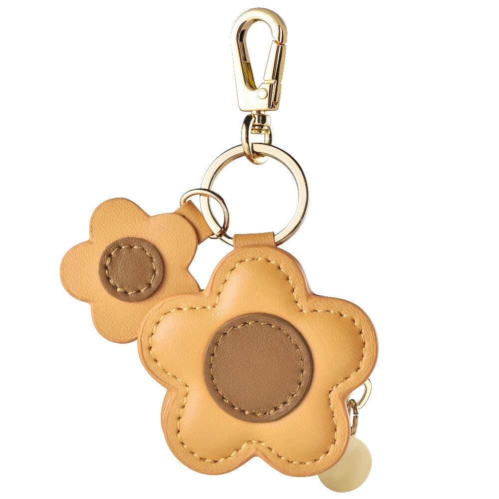 Angle. Posh Tech - Flower Leather Bag Charm for Airtag® - Brown.
