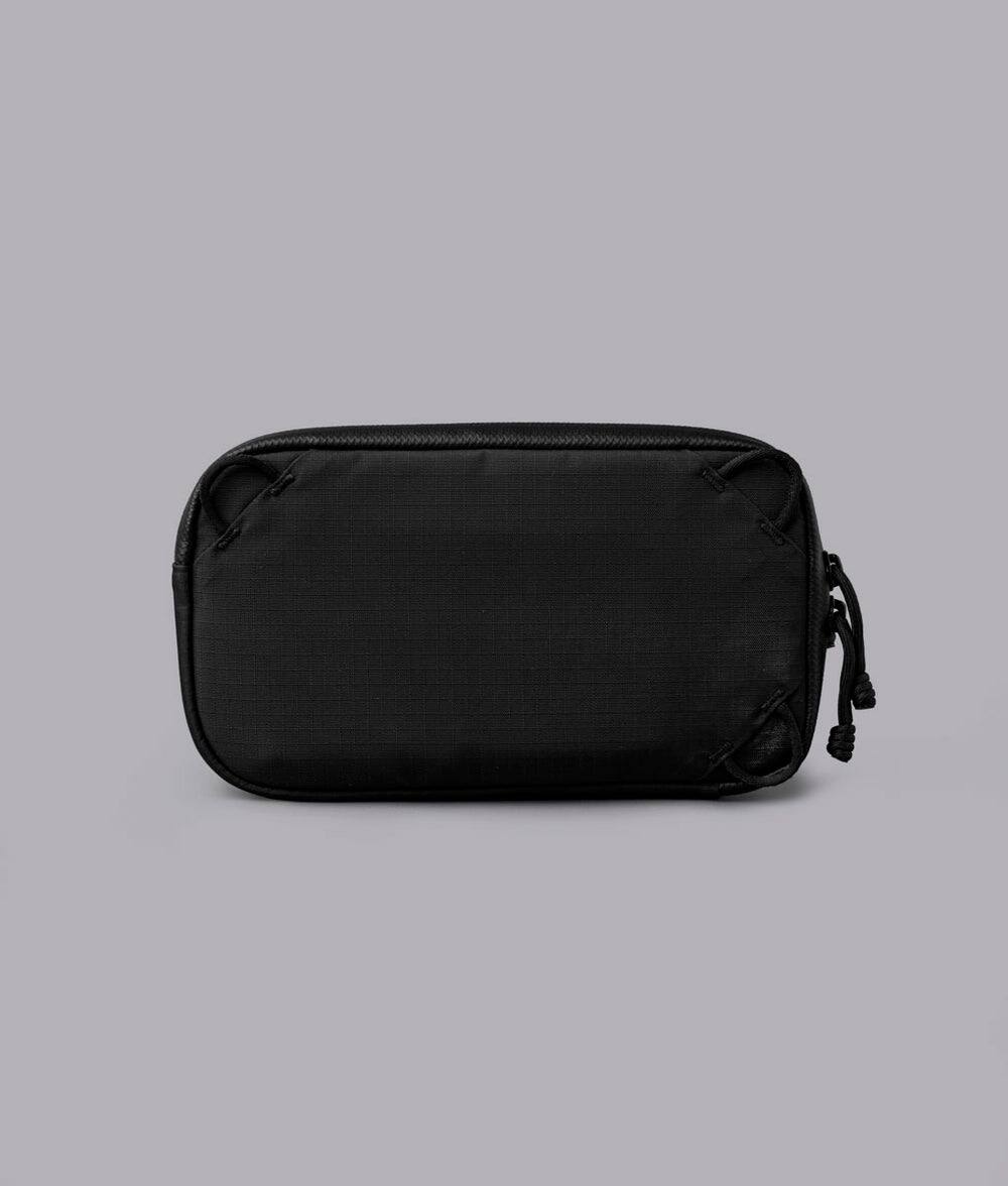 Back. ALPAKA - Bravo Passport Pouch Sling Bag for Men, Passport Holder for Travel, Fits iPhone Pro Max, RFID, AirTag Sleeve - Black Axoflux 210D.
