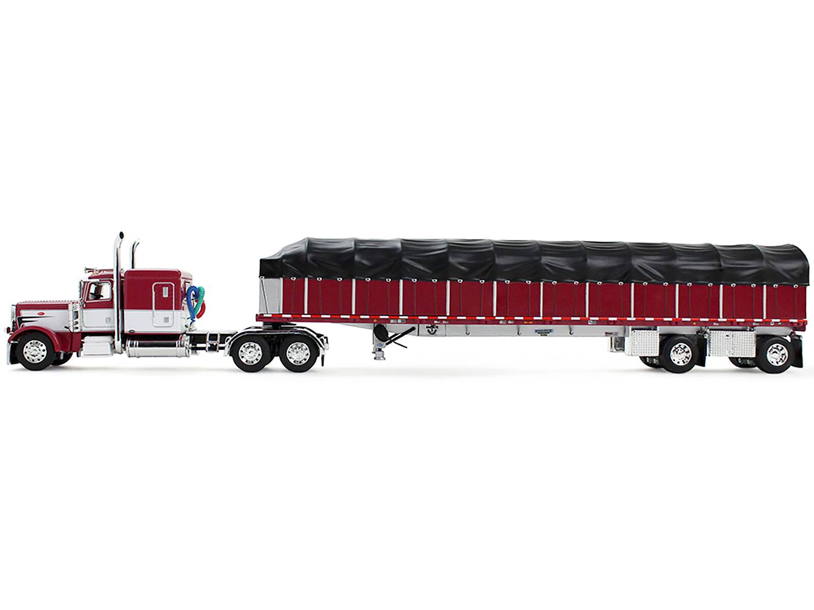 Angle. First Gear - Peterbilt 389 w/ 63" Flat Top Sleeper & 53’ Wilson Flatbed Trailer Covered Wagon Maroon/White 1/64 DCP - Maroon and White.