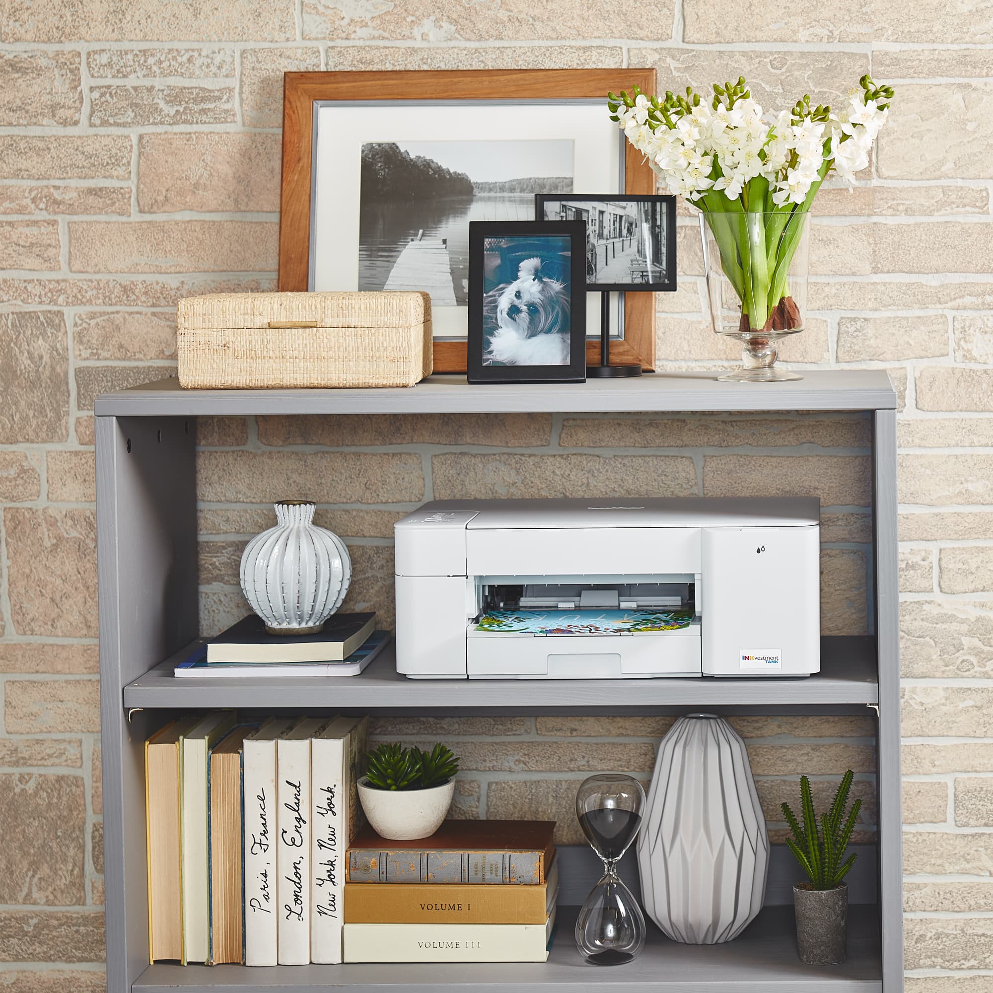 The text on the image reads: "I England York France Tlu York P Paris London, News VOLUME I VOLUME II."