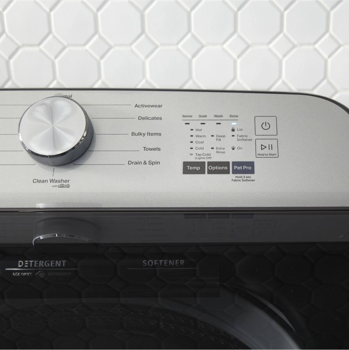 Sure, here is the corrected and grouped text from the image:
---
**Washer Settings:**
- Activewear
- Delicates
- Bulky Items
- Towels
- Drain & Spin
**Clean Washer**
**Temperature Options:**
- Hot
- Warm
- Cool
- Cold
- Tap Cold
- Lights
**Cycle Options:**
- Sense
- Soak
- Wash
- Done
**Additional Options:**
- Fabric Softener
- Fill
- Extra Rinse
- On
**Hold to Start**
**Temp**
**Options**
**Pet Pro**
**DETERGENT**
**USE ONLY DETERGENT**
**SOFTENER**
**Hold 3 sec Fabric Softener**
---
This should cover all the text from the image in a clear and organized manner.