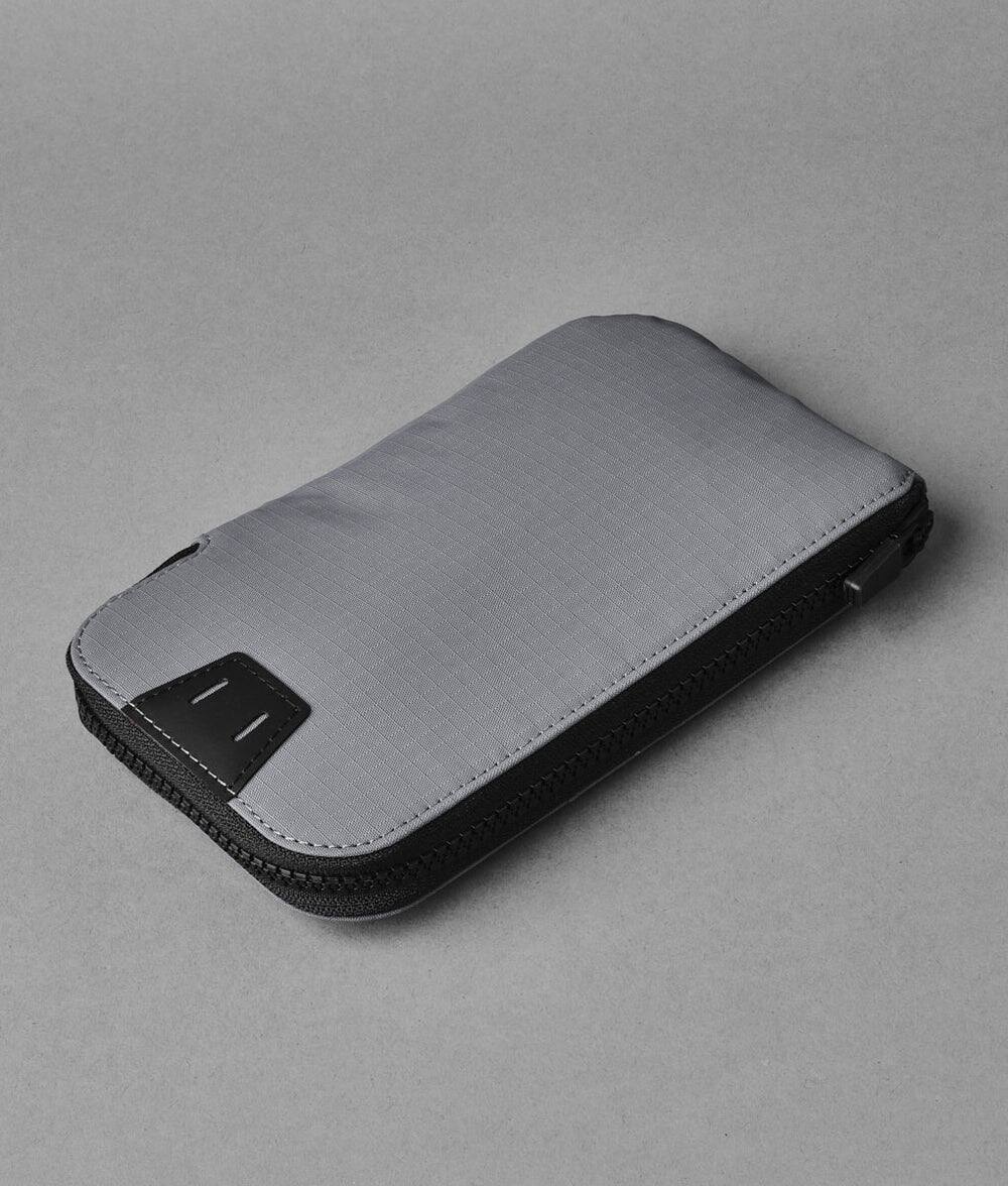 Back. ALPAKA - Zip Travel Wallet - RFID Passport Holder, Self Locking Zipper Wear,3 passport pockets and 2 Card Slots - Grey Axoflux 210D.