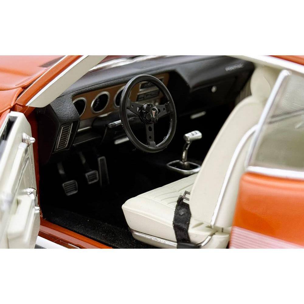 Left. ACME - 1972 Pontiac GTO LeMans Sundance Orange Metallic with GTO Stripes Limited Edition to 342 pieces Worldwide 1/18 - Orange Metallic.