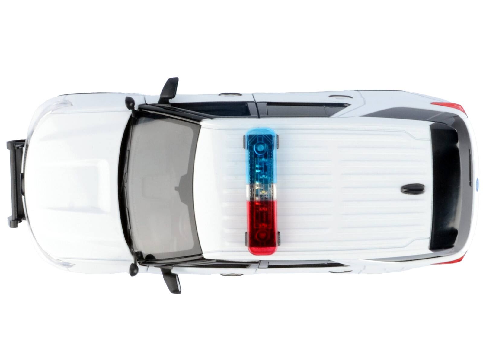 Alt View 1. Motormax - 2022 Ford Police Interceptor Utility Plain White Builder's Kit with Flashing Light Bar Front and Rear Lights Sounds 1/24 - White.