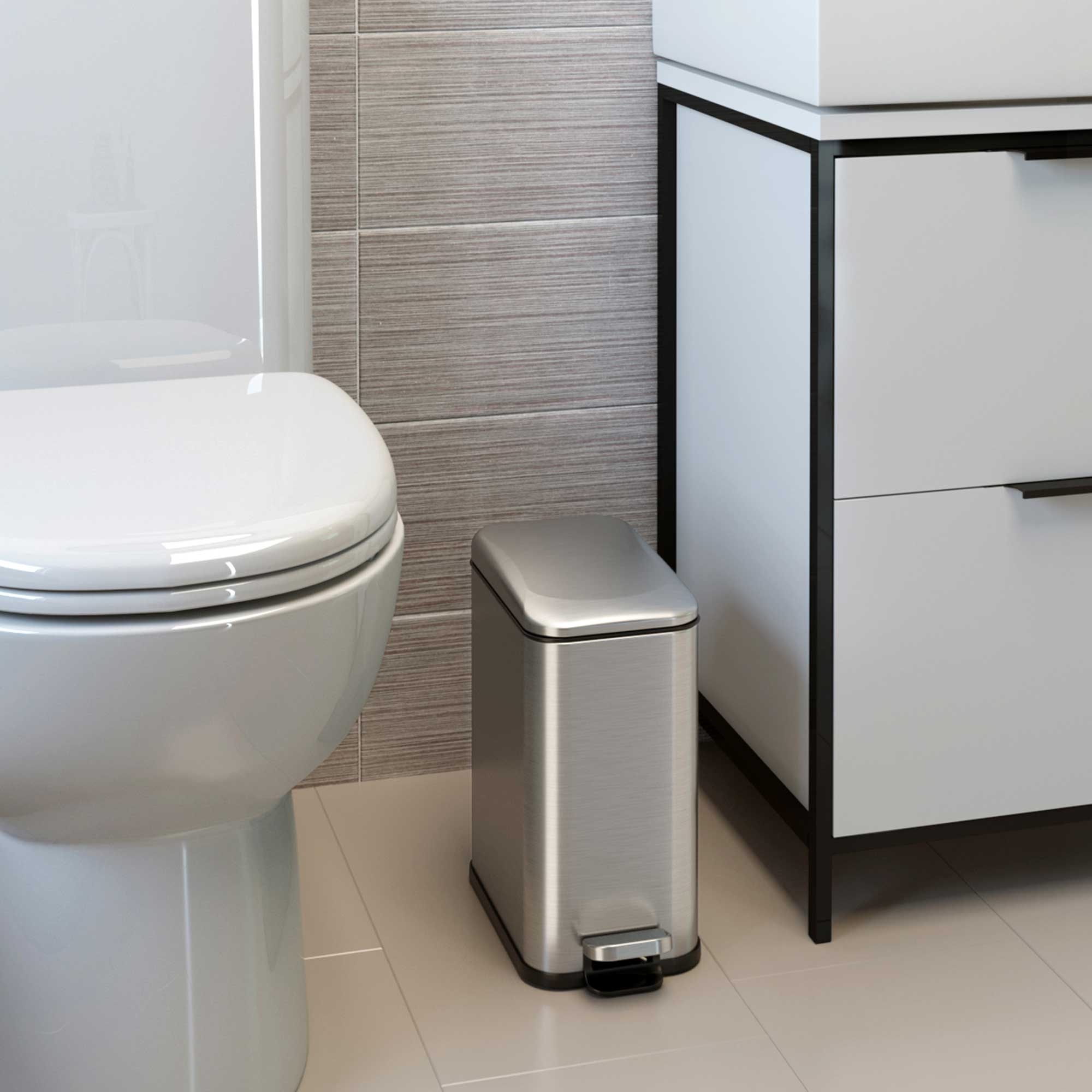 Angle. iTouchless - 1.3 Gallon SoftStep Stainless Steel Slim Step Pedal Bathroom Trash Can with AbsorbX Odor Filter - Silver.
