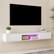 Left. Kadyn - Wall-Mounted Floating TV Stand with LED Lighting and Textured Wave Design - White.