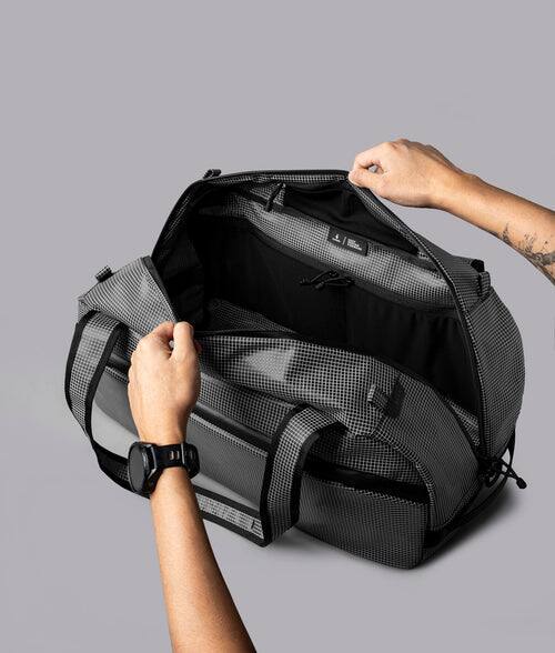 Alt View 2. ALPAKA - 35L Lightweight Duffel Bag for Gym, Weekend Trips & Carry-On Travel, Momentum Duffel, Weather-Resistant - Axodyne hybrid Grey.