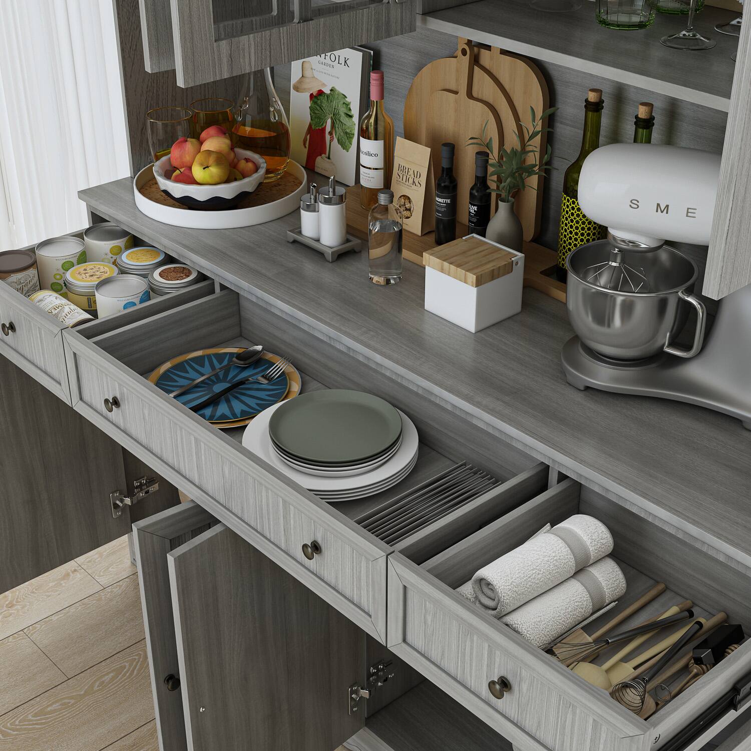 The image features a kitchen counter with various items on it. There are several bottles, including wine bottles, placed on the counter. Additionally, there are multiple cups, bowls, and apples. A cutting board is also present on the counter. The kitchen is equipped with a sink and a dishwasher. The counter is organized with various items, making it a functional and well-equipped space for cooking and food preparation.