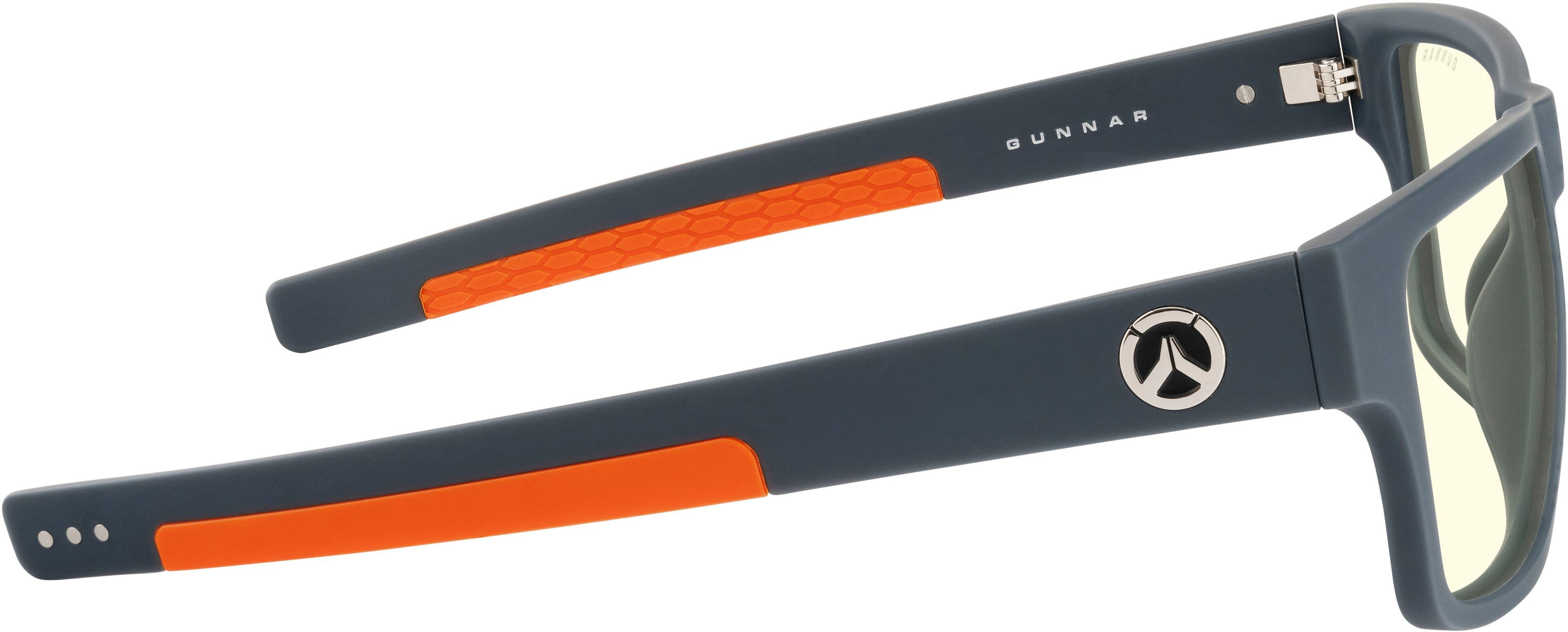 GUNNAR is a brand of sunglasses that are designed to provide comfort and protection for the eyes. The sunglasses in the image have a sleek and modern design, featuring a combination of black and orange colors. They are equipped with a strap to secure them to the wearer's head, ensuring they stay in place while being worn. The sunglasses also have a logo on them, which adds to their distinctive appearance.