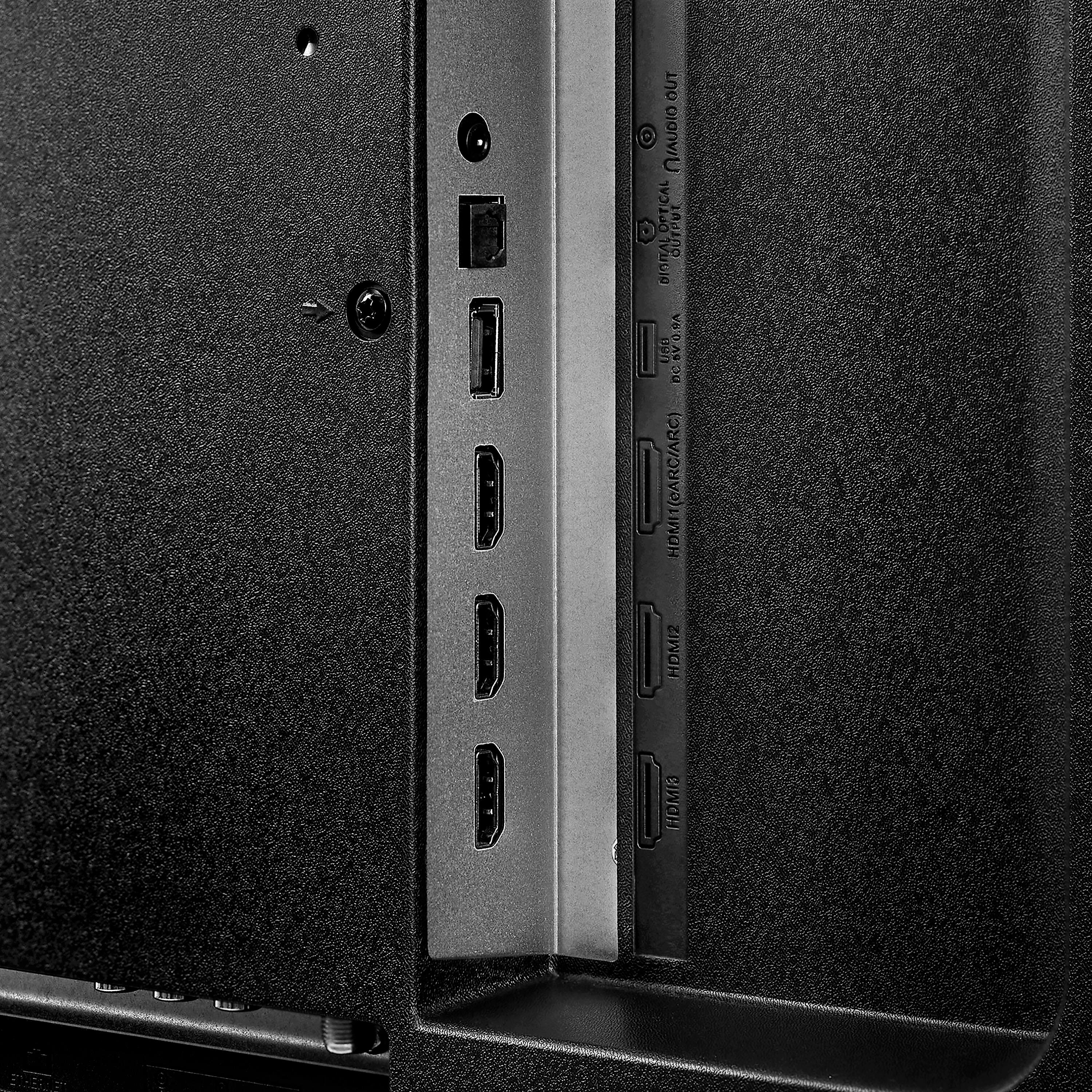 The text on the image reads "OUTPUT JACKS: 2 HDMI, 1 VGA, 1 ARC, 1 LAN, 1 COM." This indicates that the computer has multiple output options, including two HDMI ports, one VGA port, one ARC port, one LAN port, and one COM port.