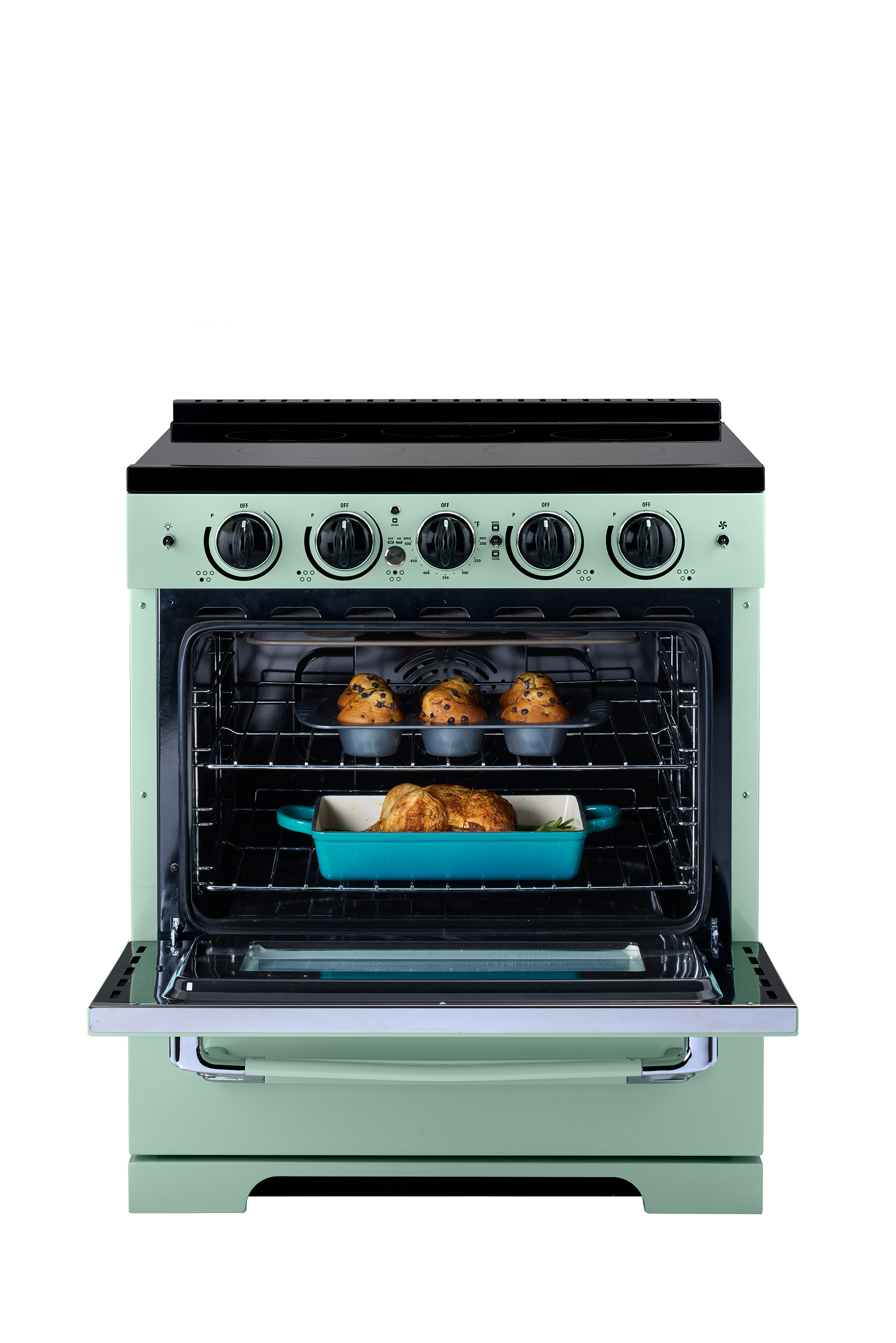 The image shows a green oven with two trays of food inside. The oven is filled with chicken, and there are multiple chicken pieces visible in the trays. The oven is placed next to a stove, and the scene is set against a white background.