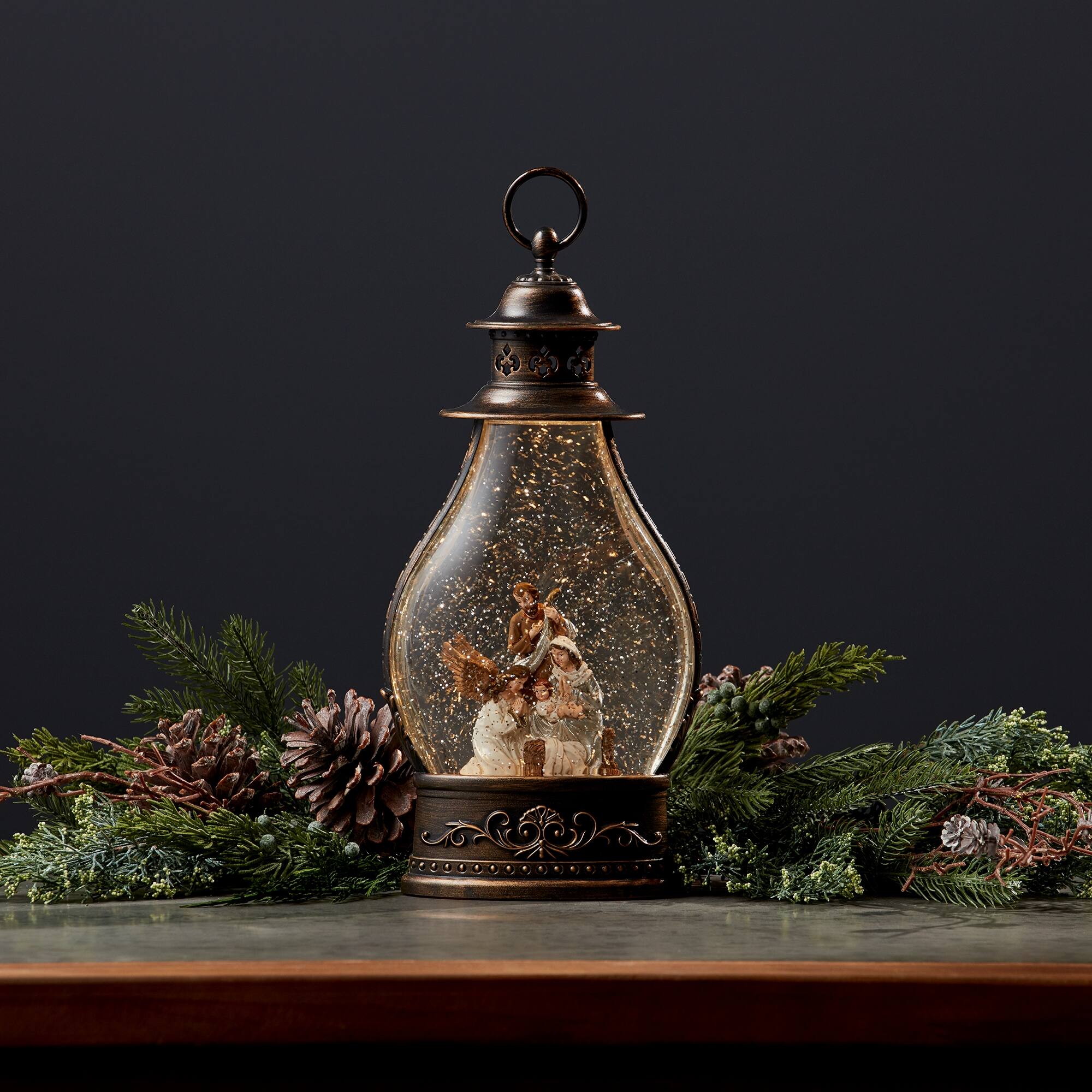 Angle. BreeBe - LED Snow Globe Lantern with Holy Family Nativity Scene 15.5"H - Bronze, White, Gold.