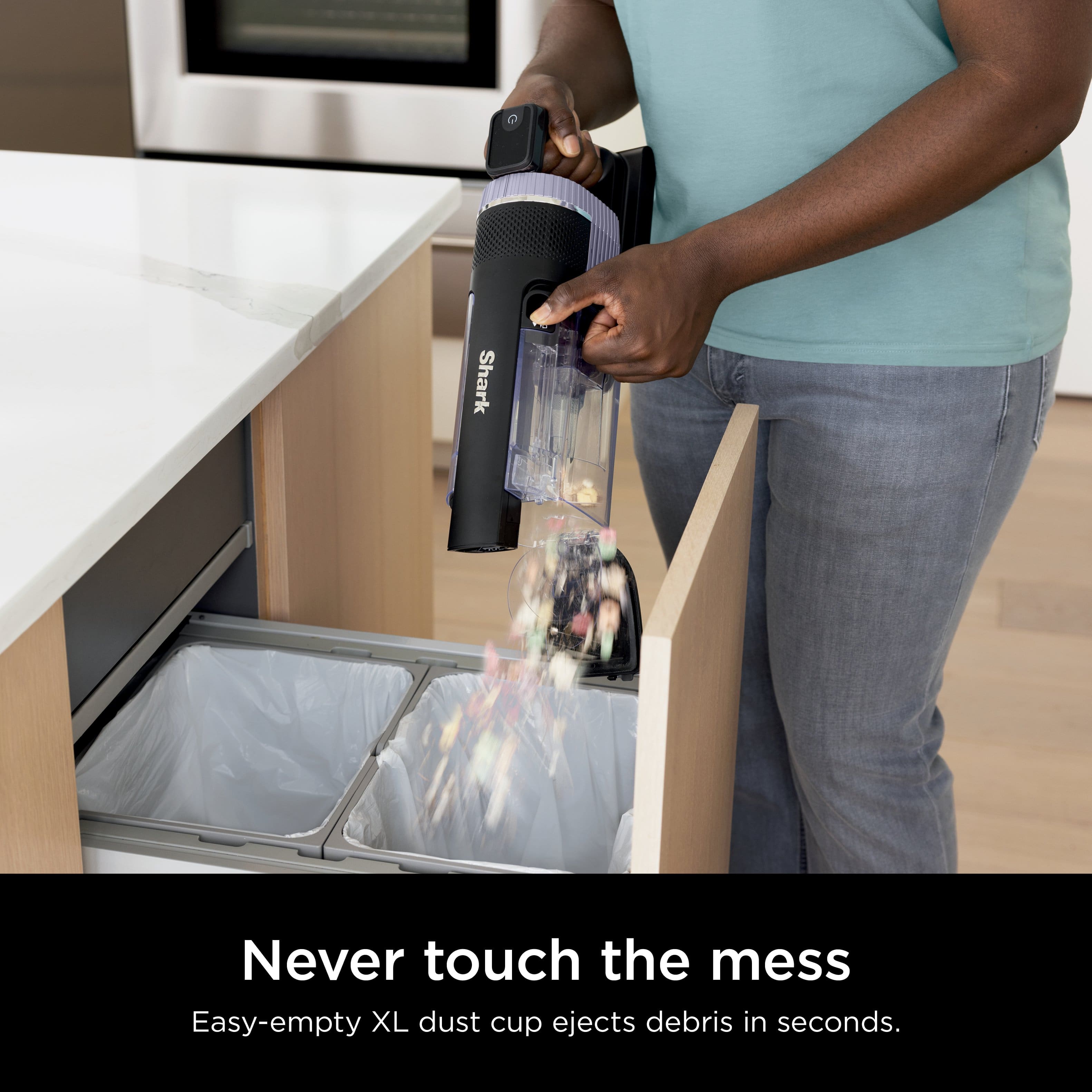 Shark Never touch the mess Easy-empty XL dust cup ejects debris in seconds.