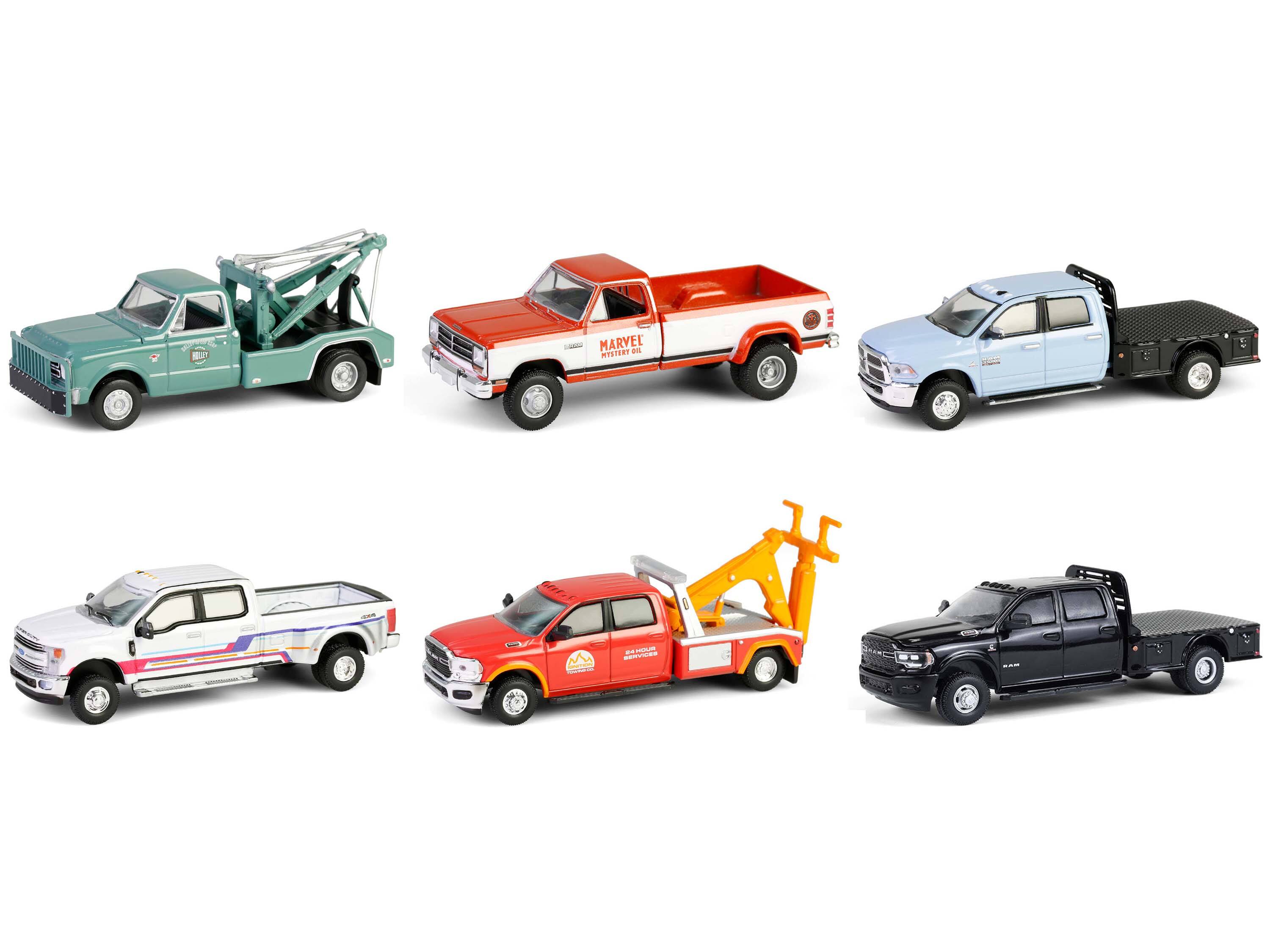 Sure, here is the corrected and grouped text from the image:

1. **Top Row:**
   - "MARVEL"
   - "MISNIST"
   - "05 1 1"
   - "D CA"
   - "aaaa"
   - "n."

2. **Trucks:**
   - "HOLLY"
   - "MARVEL MOTOR OIL"
   - "24 HOUR SERVICES"
   - "RAM"