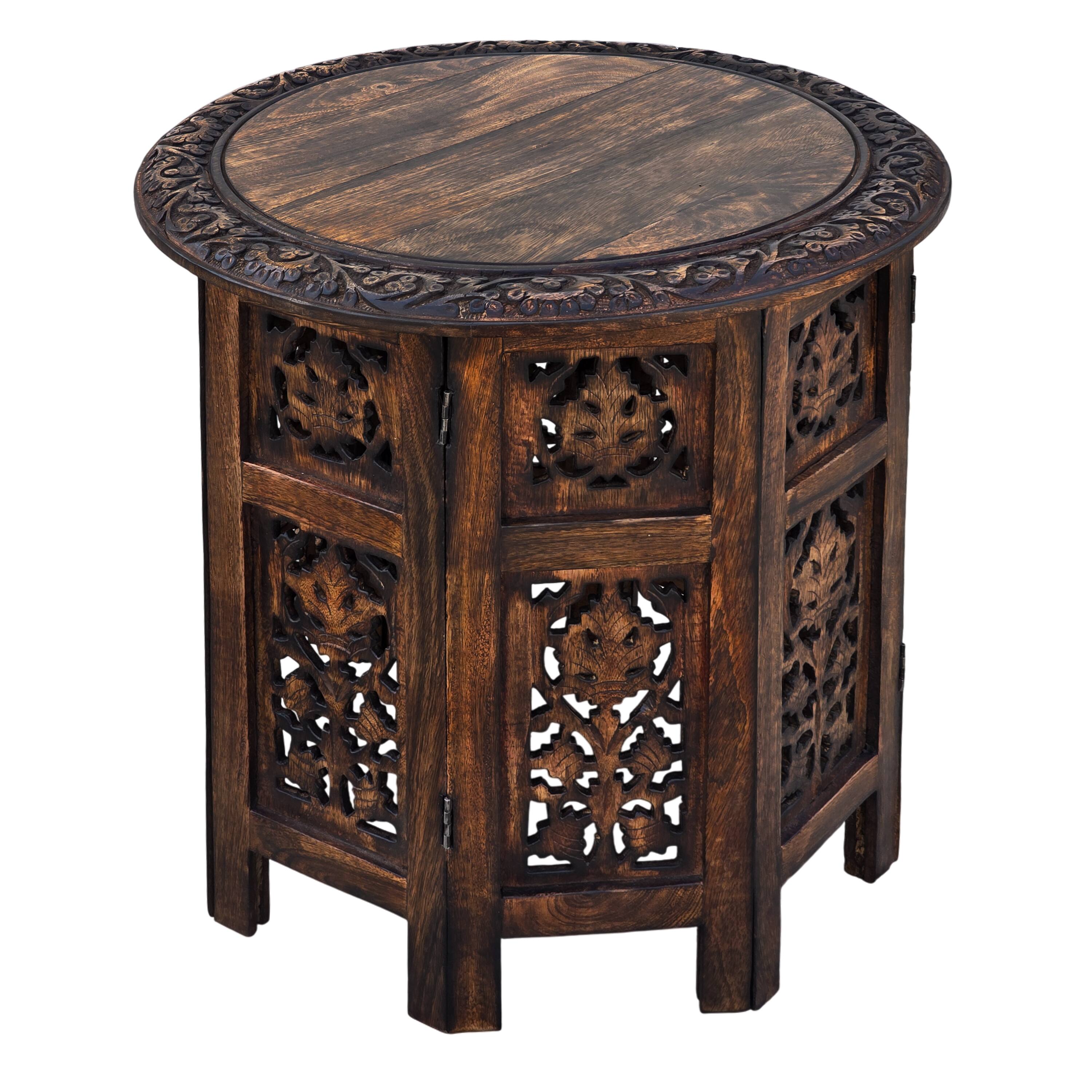 Angle. Manhattan Lane - 18 Inch Mango Wood Folding Accent Table, Hand Carved - Brown.