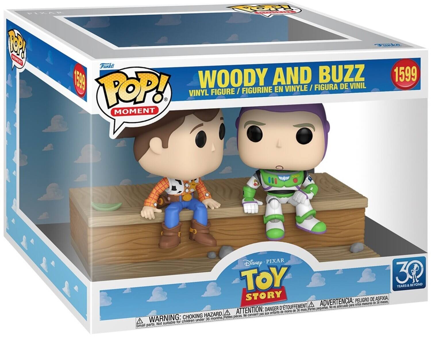 **Front of the Box:**

- **Top Left Corner:**
  - "POP! MOMENT"

- **Top Right Corner:**
  - "1599"

- **Main Title:**
  - "WOODY AND BUZZ"
  - "VINYL FIGURE / FIGURINE EN VINYLE / FIGURA DE VINIL"

- **Brand:**
  - "Funko"

- **Bottom Section:**
  - "Disney PIXAR TOY STORY"
  - "30 YEARS & BEYOND"

- **Warning Label:**
  - "WARNING: CHOKING HAZARD △ ATTENTION: DANGER D'ÉTOUFFEMENT △ ADVERTENCIA: PELIGRO DE ASFIXIA"
  - "Small parts. Not suitable for children under 36 months. / Petites pièces. Ne convient pas aux enfants de moins de 36 mois. / Piezas pequeñas. No es adecuado para niños menores de 36 meses."

**Side of the Box:**

- **Text:**
  - "PIKAR 1P MOMENT Fko Funko 1599 WOODY AND BUZZ 1