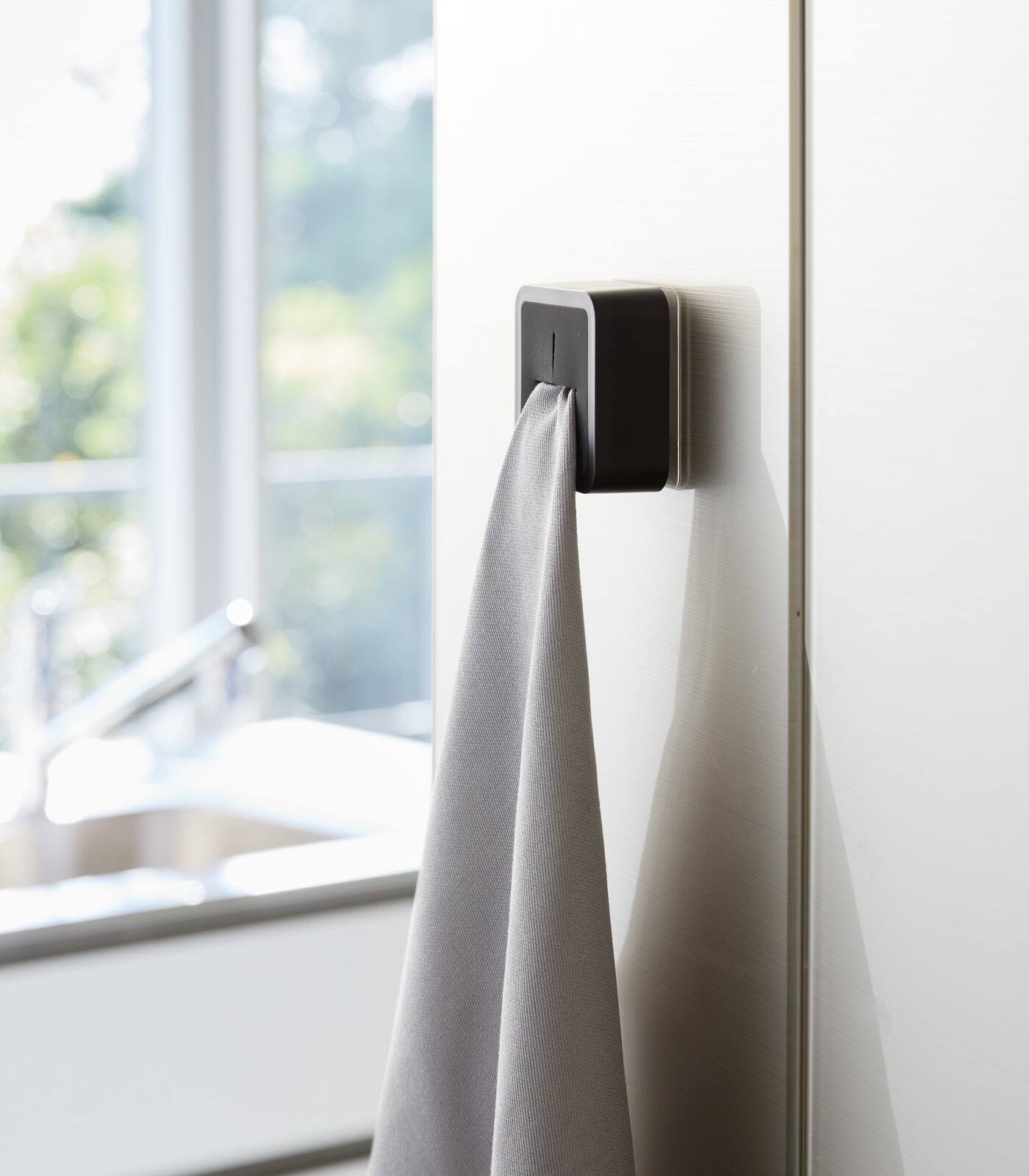 Angle. Yamazaki Home - Traceless Adhesive Kitchen Towel Holder - Black.