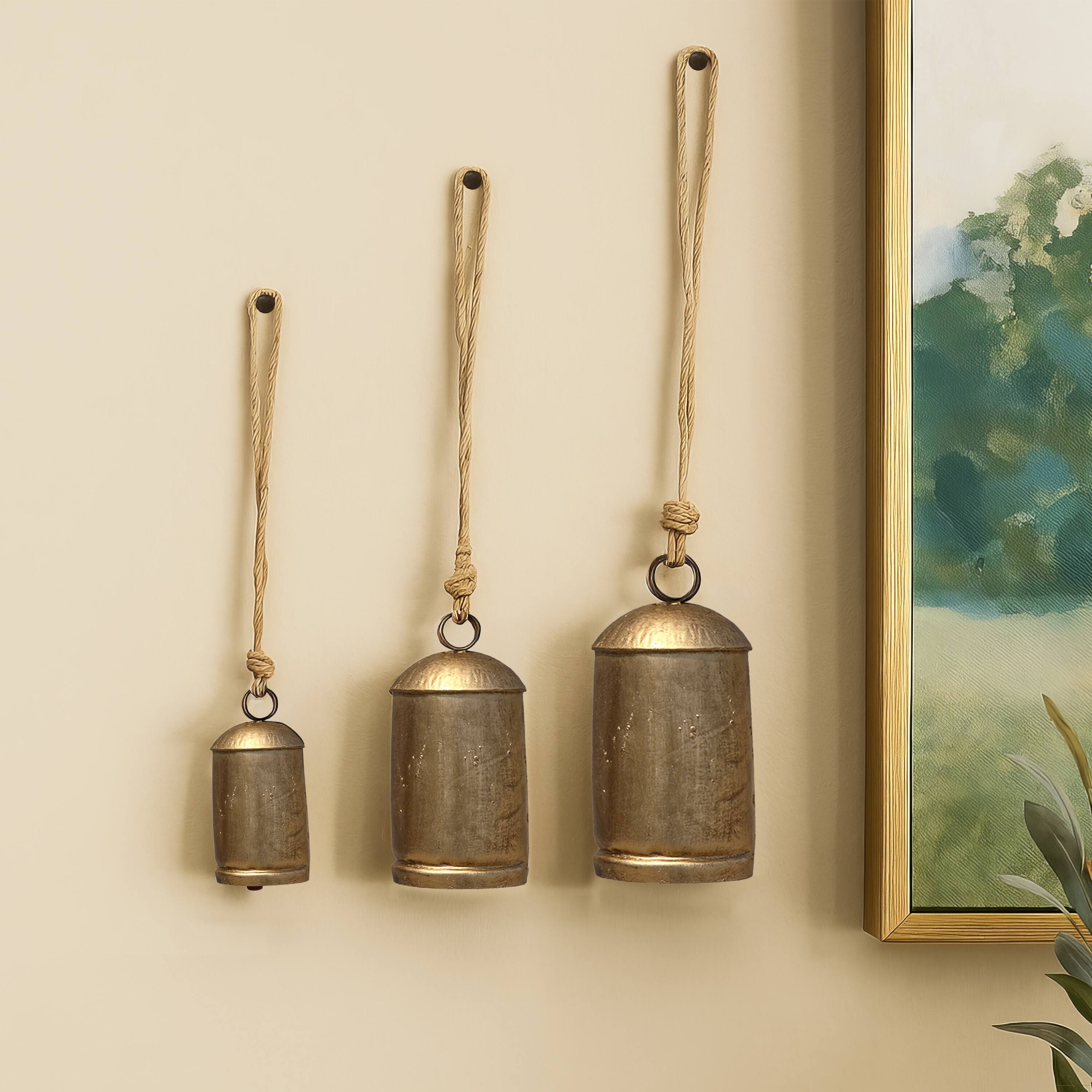Alt View 8. Manhattan Lane - Zaira Decorative Iron Cow Bells Set of 3 | Cylindrical | Antique Gold Finish| Jute Hanging Rope | 20, 15, 12 Inches - Gold.