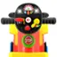 "STOP" is written on a red and green button on a toy steering wheel.