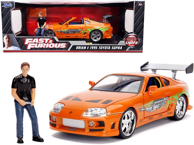 1995 Toyota Supra with Lights and Brian Figurine "Fast & Furious" Movie 1/18 Diecast Model Car by Jada - Orange Metallic