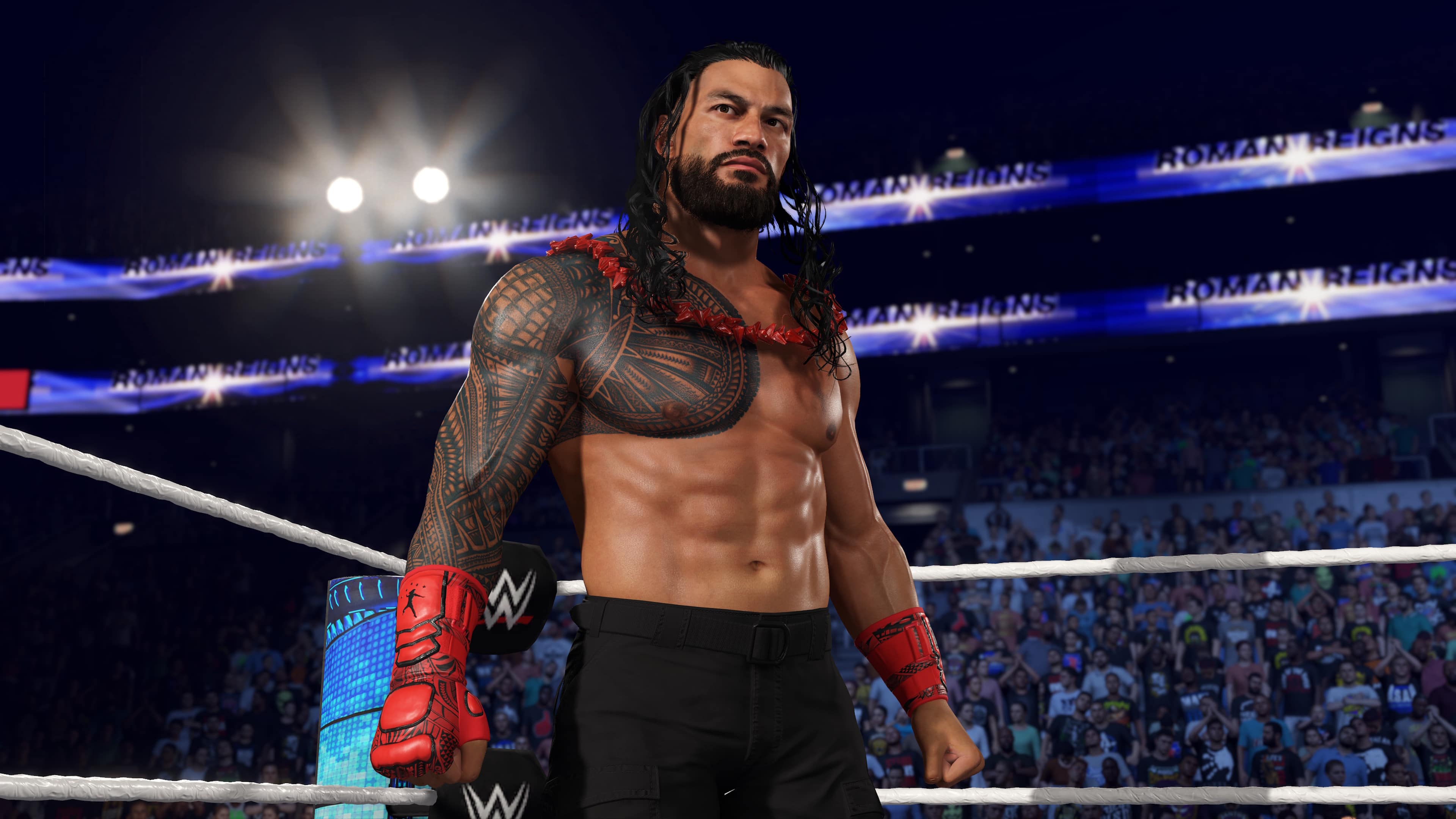 Roman Reigns is a professional wrestler who is standing in the ring, wearing a red and black outfit. He is a member of the WWE, and is known for his powerful and aggressive style in the ring. The image captures him in a moment of intensity, as he prepares to face his opponent.