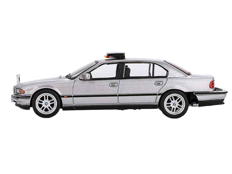 Angle. Mini GT - BMW 750IL Gray Metallic 007 James Bond "Tomorrow Never Dies" (1997) Movie Limited Edition 1/64 - Gray Metallic.
