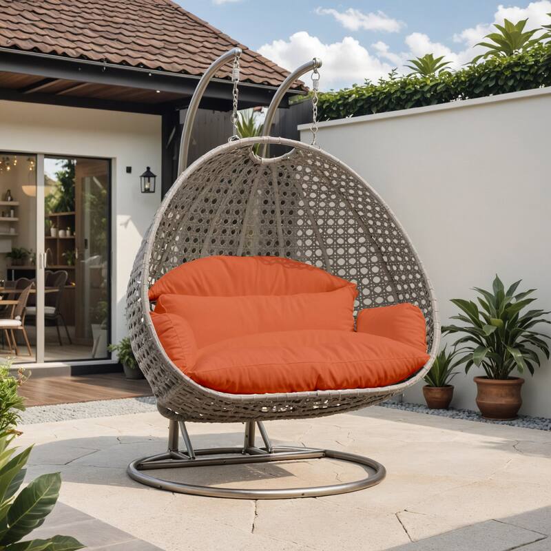 Angle. LeisureMod - Leisuremod 2-Person Wicker Egg Swing Chair with Stand & Washable Cushions - Indoor/Outdoor Double Hanging Patio Chair - Orange.