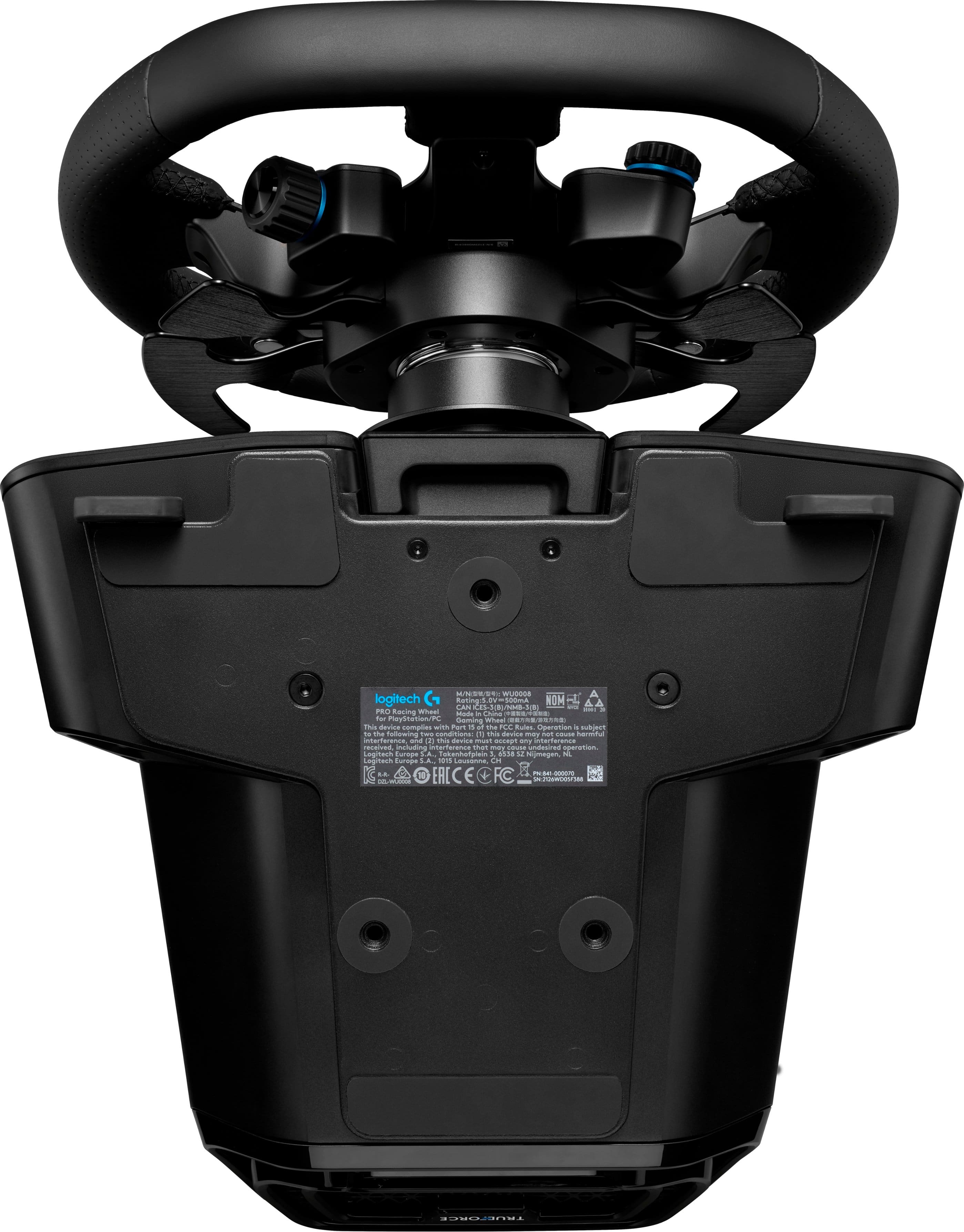 The text on the image reads: "MR WE:WE . addas logitech G Caning DV 10umA NOM - CAN CAs e-L I - i P Recing whas Mode i nio Fada 3 naysnetion/PC Si Whaai . This davics comples w Par 1 at the F fuies Operation a nubjenn - te fullewing twu cendisiena: sha deuies my mt MusE hanau asseuhato ala 2 - davies Ep dny interferencs ressved inchuding pranc s S C ndesnes speration Soginach Suraga Ta 1 s .. Humegmn A Legitech Eurage LA. 1015 - 2 . 30 EAC - s - - dda - Pamonrsa TIO..IN."