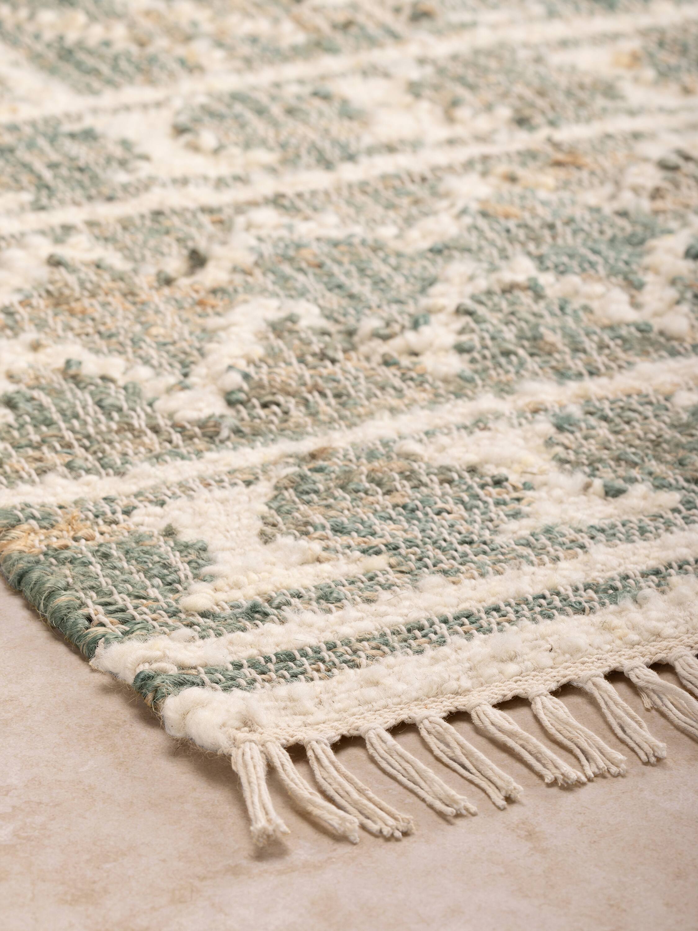 Left. GAURI KOHLI - Ardmore Rug - Shades of green and beige.