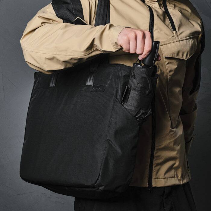 Alt View 4. ALPAKA - Metro Tote Laptop Tote Bag for Work, Work Tote Fits 16" MacBook Pro, Side Bottle Pocket, Weather-Resistant, Key Tether - Grey Axoflux 210D.
