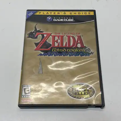 The text on the image should be grouped and corrected as follows:
"PLAYER'S CHOICE FOR NINTENDO GAMECUBE: THE LEGEND OF ZELDA: THE WIND WAKER. EVERYONE. CONTENT RATED ESRB BEST SELLER. Nintendo."
This correction ensures proper capitalization and punctuation for clarity. - E (Everyone)