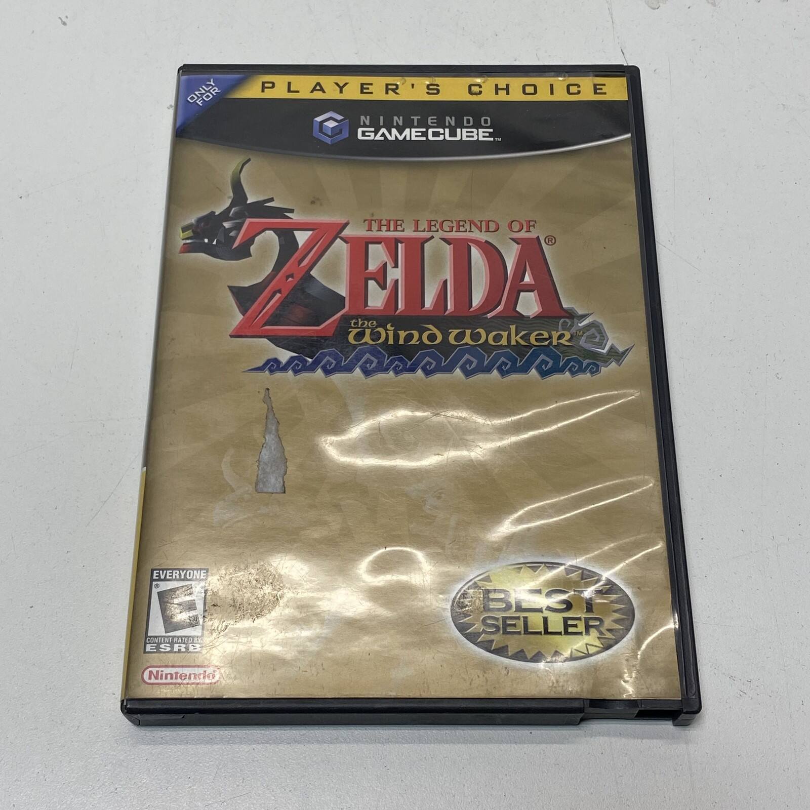 The text on the image should be grouped and corrected as follows:

"PLAYER'S CHOICE FOR NINTENDO GAMECUBE: THE LEGEND OF ZELDA: THE WIND WAKER. EVERYONE. CONTENT RATED ESRB BEST SELLER. Nintendo."

This correction ensures proper capitalization and punctuation for clarity. - E (Everyone)