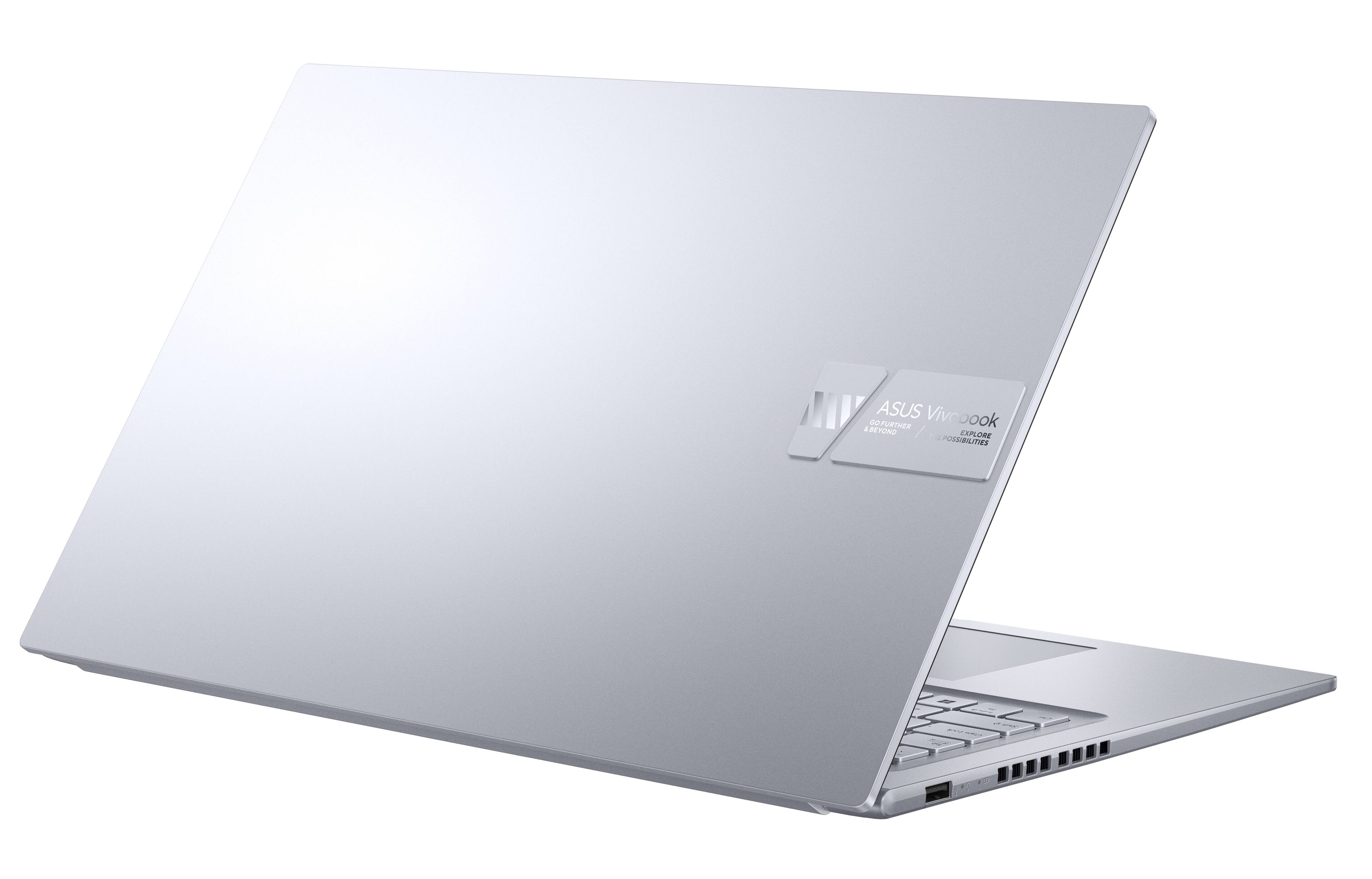 The text on the image reads "ASUS Vivobook J DDFURTHER REYONO / EXPLORE POSSIBILITIES."