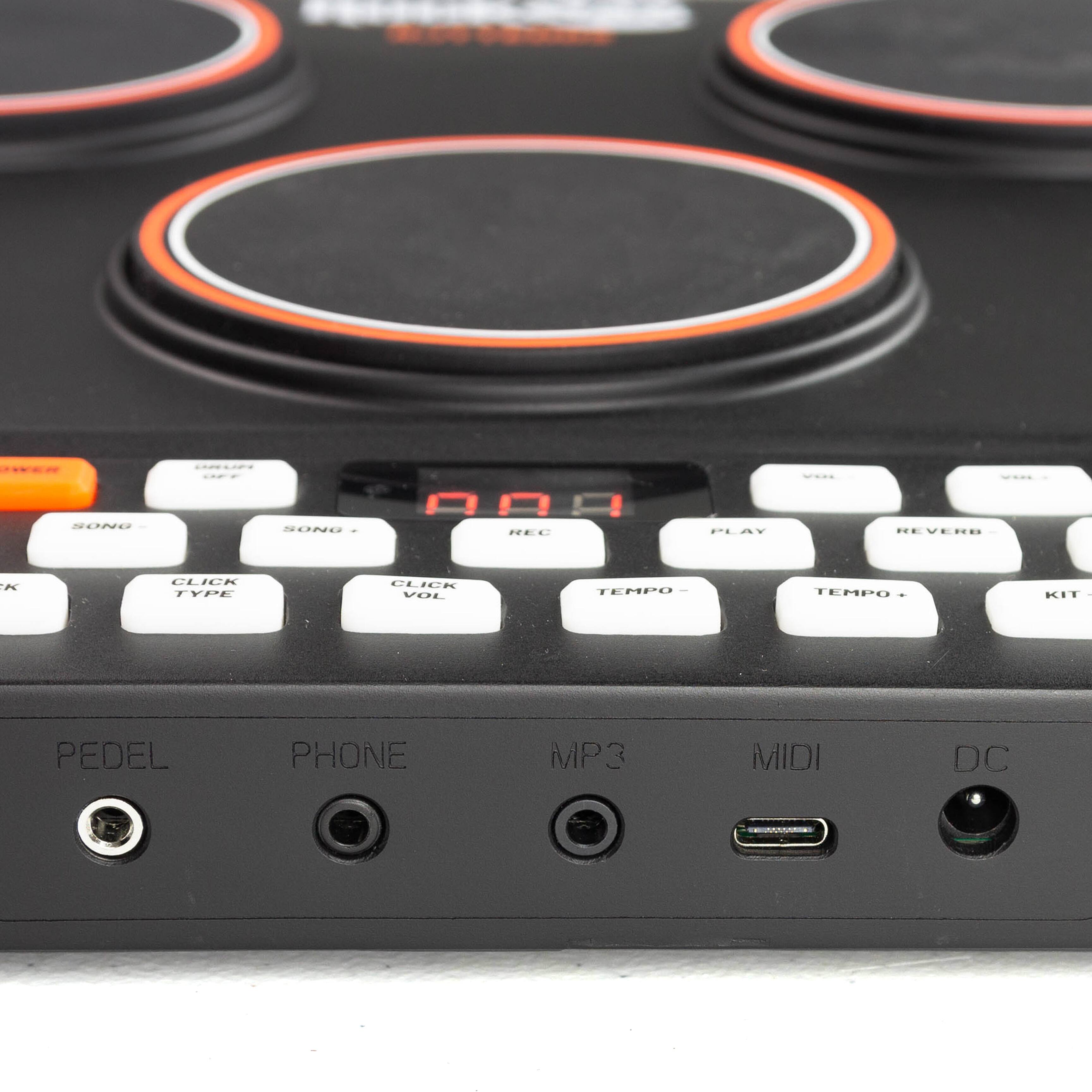 Sure, here is the corrected and grouped text from the image:

- **Buttons:**
  - SONG -
  - SONG +
  - REC
  - PLAY
  - REVERB
  - CLICK TYPE
  - CLICK VOL
  - TEMPO -
  - TEMPO +
  - KIT

- **Ports:**
  - PEDEL
  - PHONE
  - MP3
  - MIDI
  - DC

- **Text on the Device:**
  - "REVERB"
  - "000" (displayed on the screen)