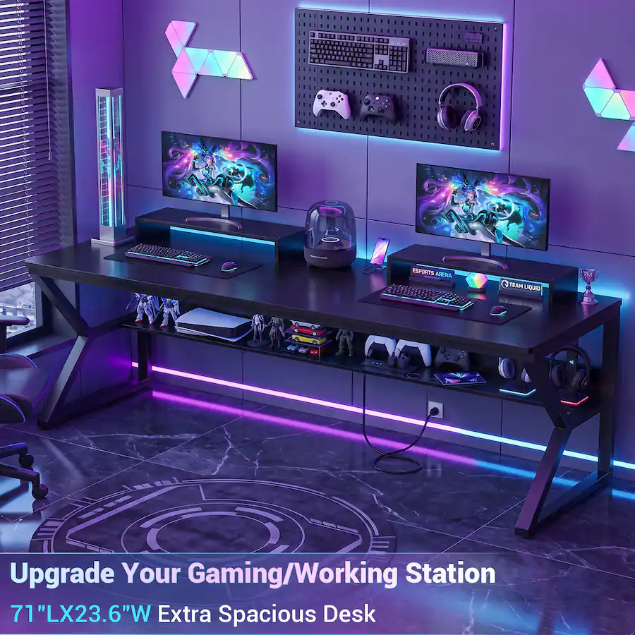 Gaming workstation setup with a black desk and neon lighting.