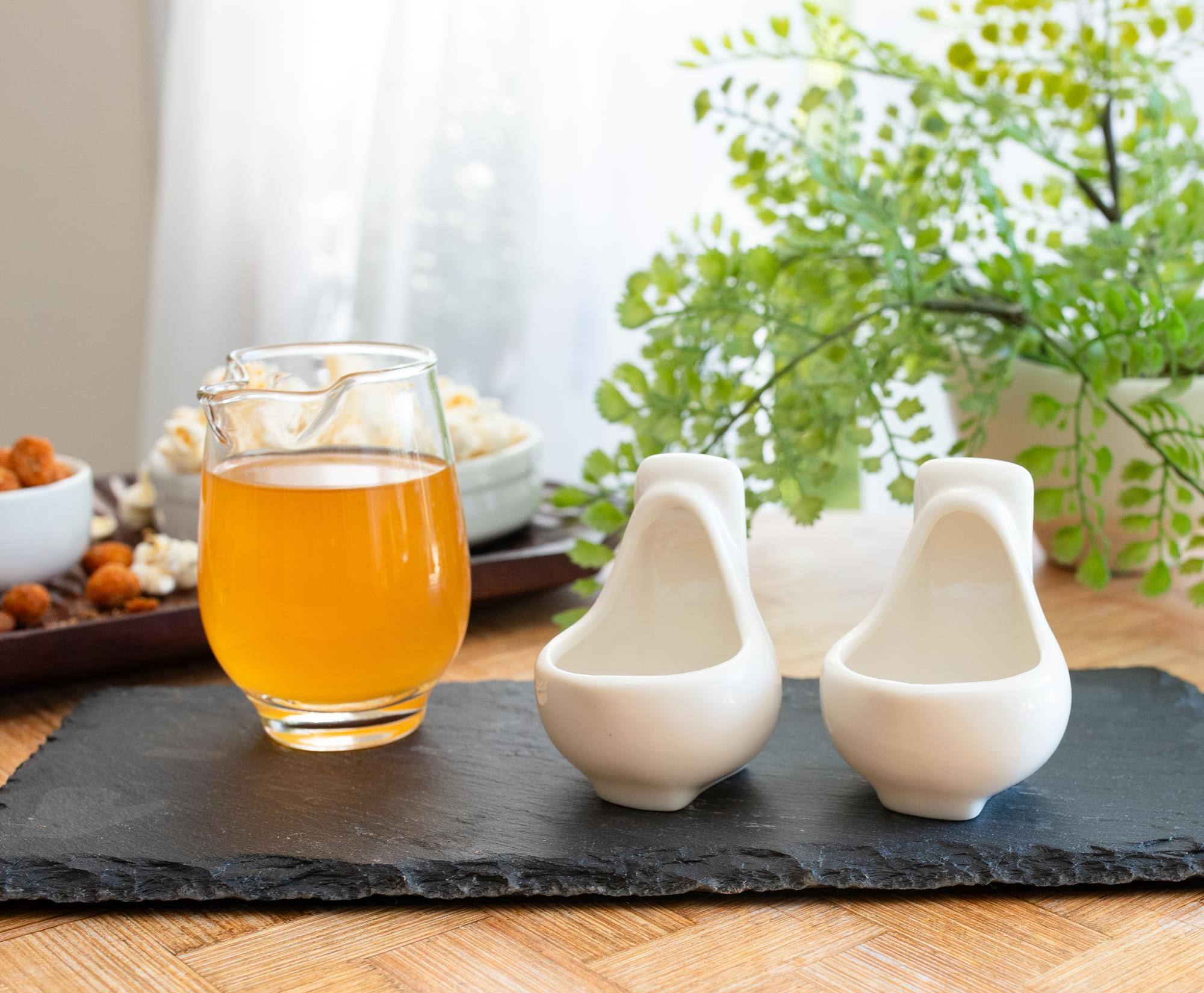 Alt View 2. Silver Buffalo - Urinal 1-Ounce Sculpted Ceramic Shot Glasses | Set of 2 - White.