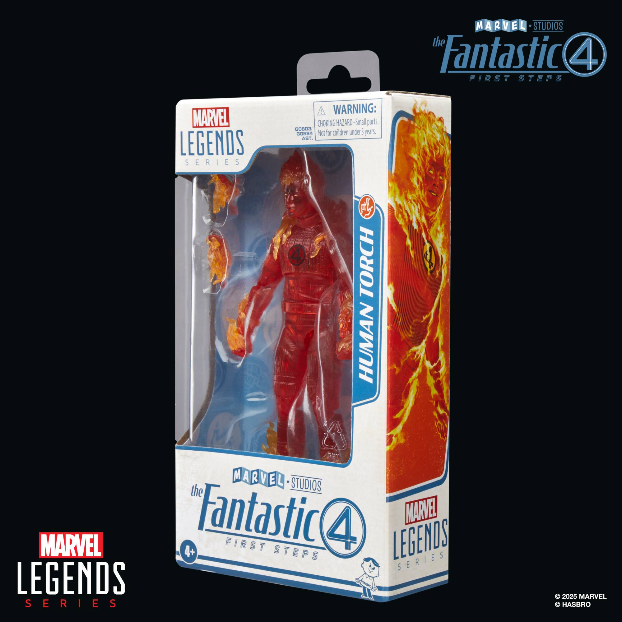 The image features a Marvel Legends Series action figure of the Human Torch from the Fantastic Four. The figure is packaged in a box, which warns of choking hazards due to small parts. The box is part of the Marvel Legends First Steps series, designed for children. The figure is displayed on a black background, showcasing the character's unique features and design.